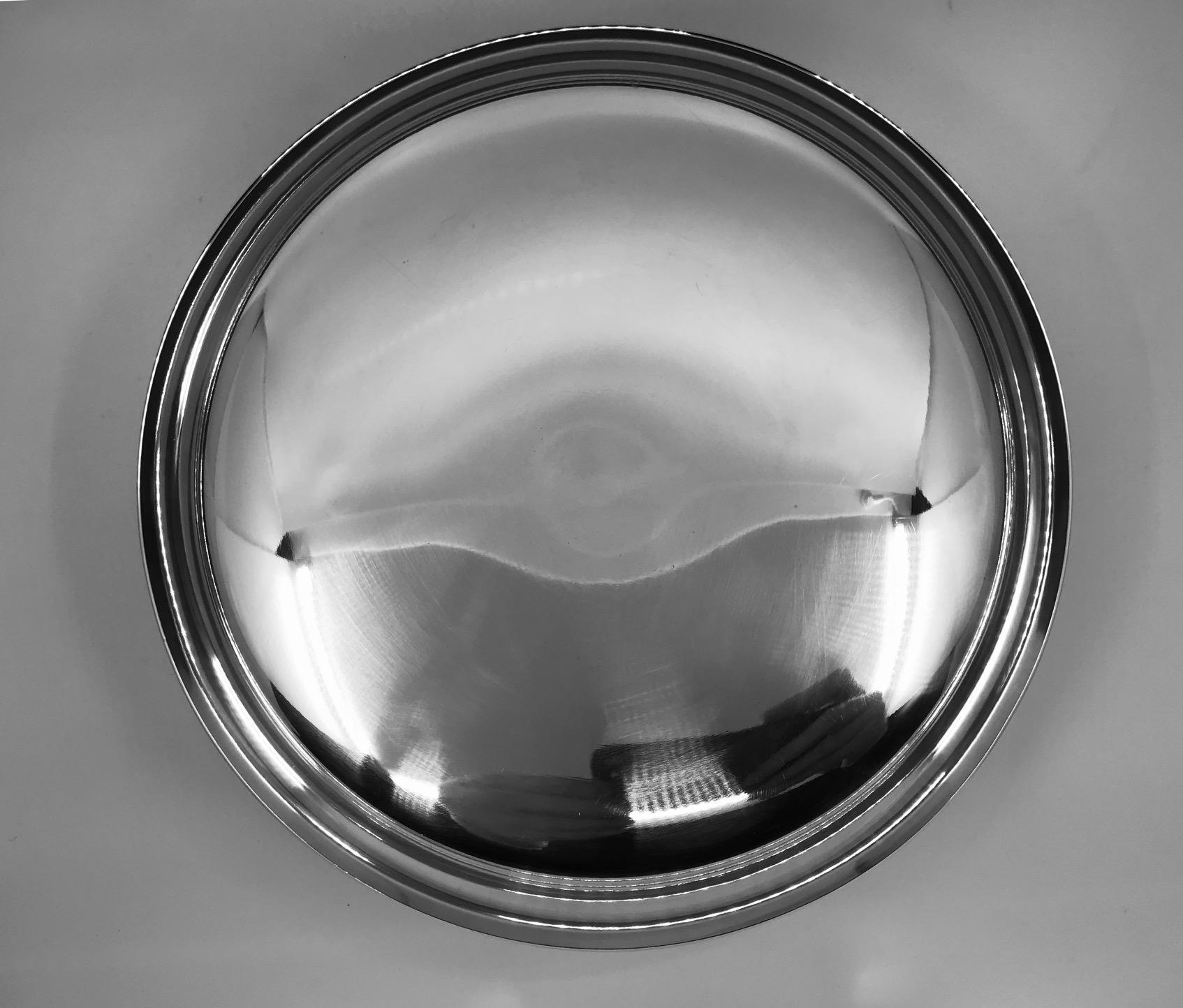 Large Georg Jensen modern sterling silver bowl, design #1132A by Henning Koppel from the 1960s. Beautiful organic midcentury design, Koppel designed his pieces to reflect light, bringing an otherwise simple design very much to life.
Measures: 11