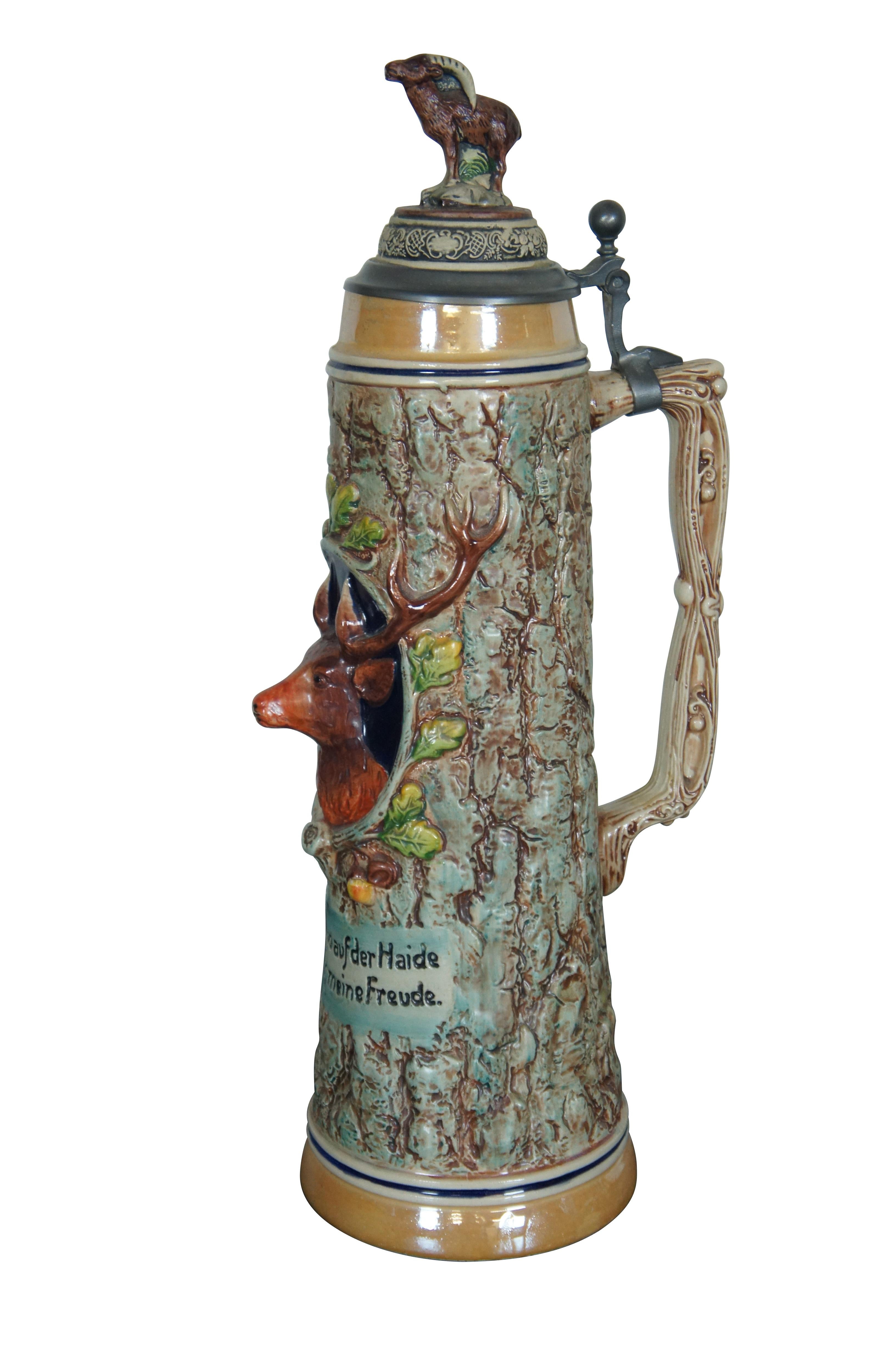 Large Vintage German Gerzit hand made two liter beer stein / lidded (pewter) mug or tankard featuring a stag / deer / ram / goat theme.  Text reads: Im Wald und aufder Haide da such ich meine Freude.  Translated to 
I look for my joy in the forest