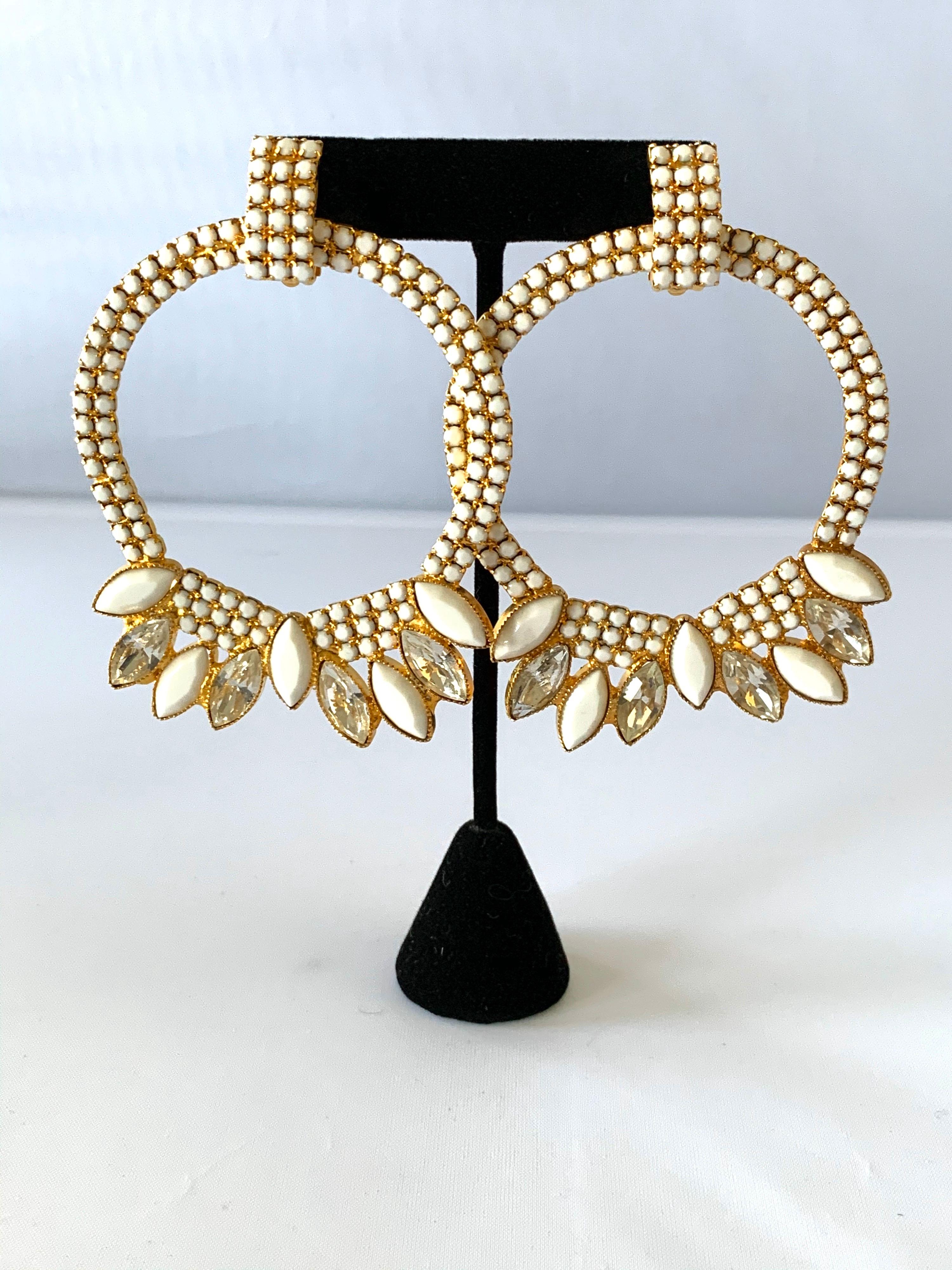 Large vintage hoop statement clip-on earrings - comprised out of gilt metal in an architectural manner the earrings are adorned by German white glass rhinestones and accented by large clear Swarovski rhinestone navettes. Designed by William de Lillo