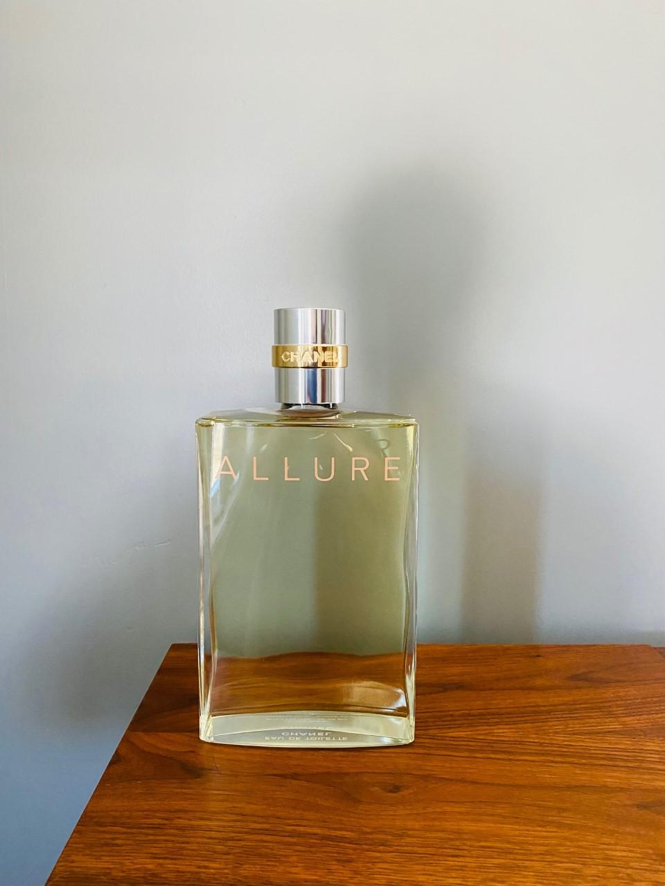 Incredibly large and iconic glass factice of Allure by Chanel. This factice follows the iconic fragrance bottle legacy that is Chanel. The large scale of this piece is softened by the clean simple lines of the bottle design. Following the legacy of