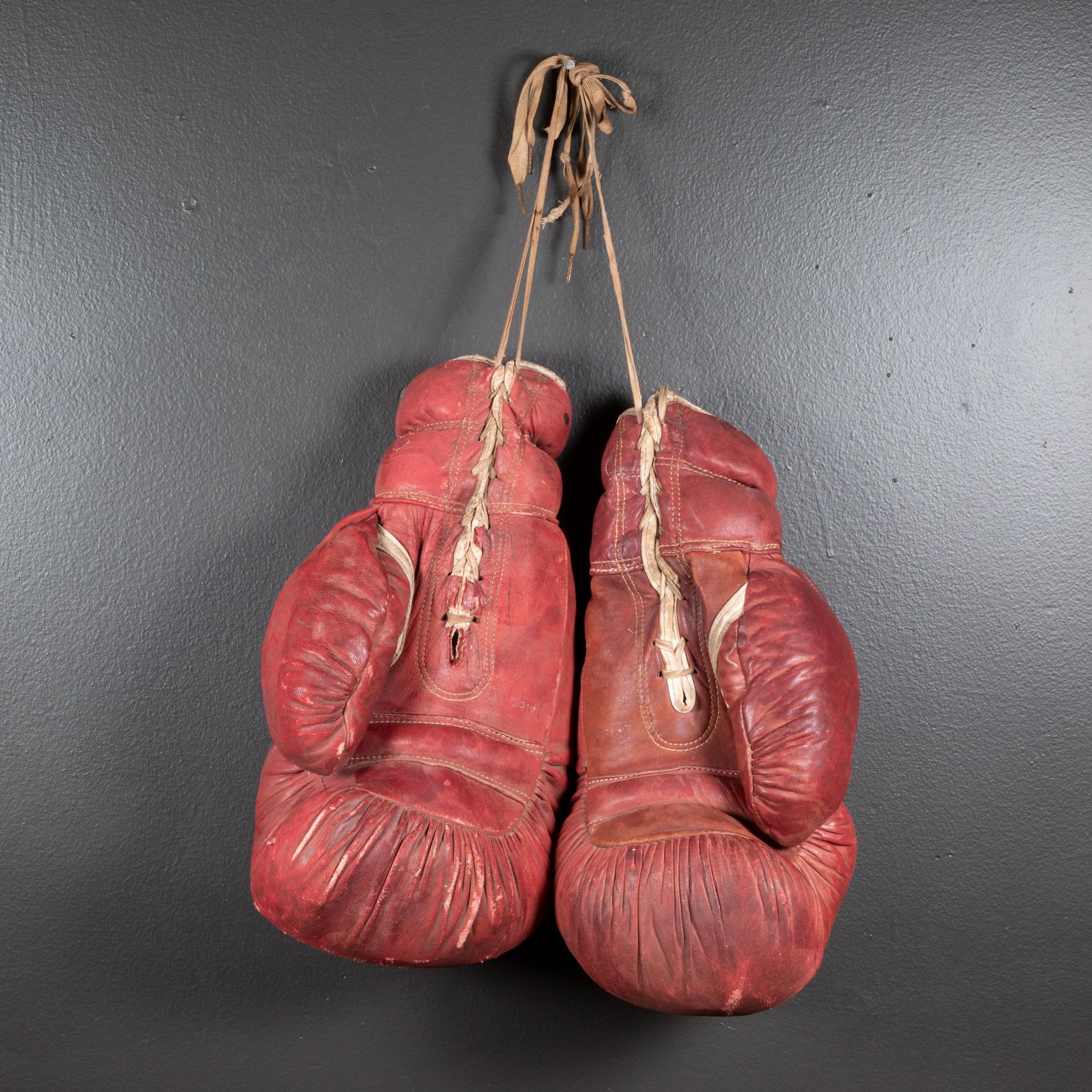 ABOUT

Original boxing gloves with reddish brown leather filled with horse hair. The leather is very soft and in good condition. Faint original label on each glove.

    CREATOR Gold Smith Co.
    DATE OF MANUFACTURE c.1950-1960.
    MATERIALS AND