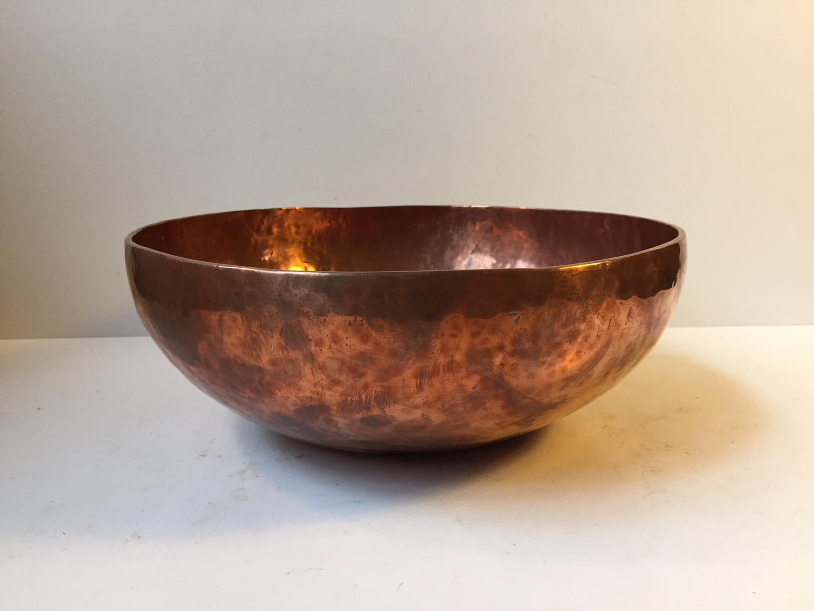 Large hand-hammered Tibetan copper bowl. It is called a Chö-pa. A singing bowl with its own unique sound created by hitting it with your knuckle. According to ancient beliefs the sound mimics the sound of the solar-system. It is uses during
