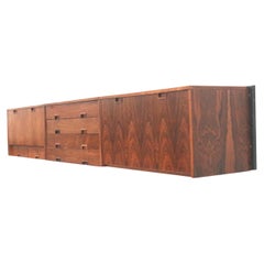 Large vintage hanging sideboard / wall system made of rosewood made in the 60s