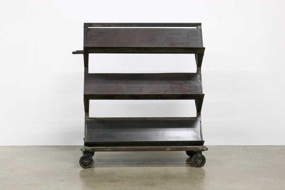 Double-sided rolling shelve cart. Ideal for arts, books, plates and other display.
On rollers.
Measures: 51.75 in. H x 47 in. W x 25 in. D.