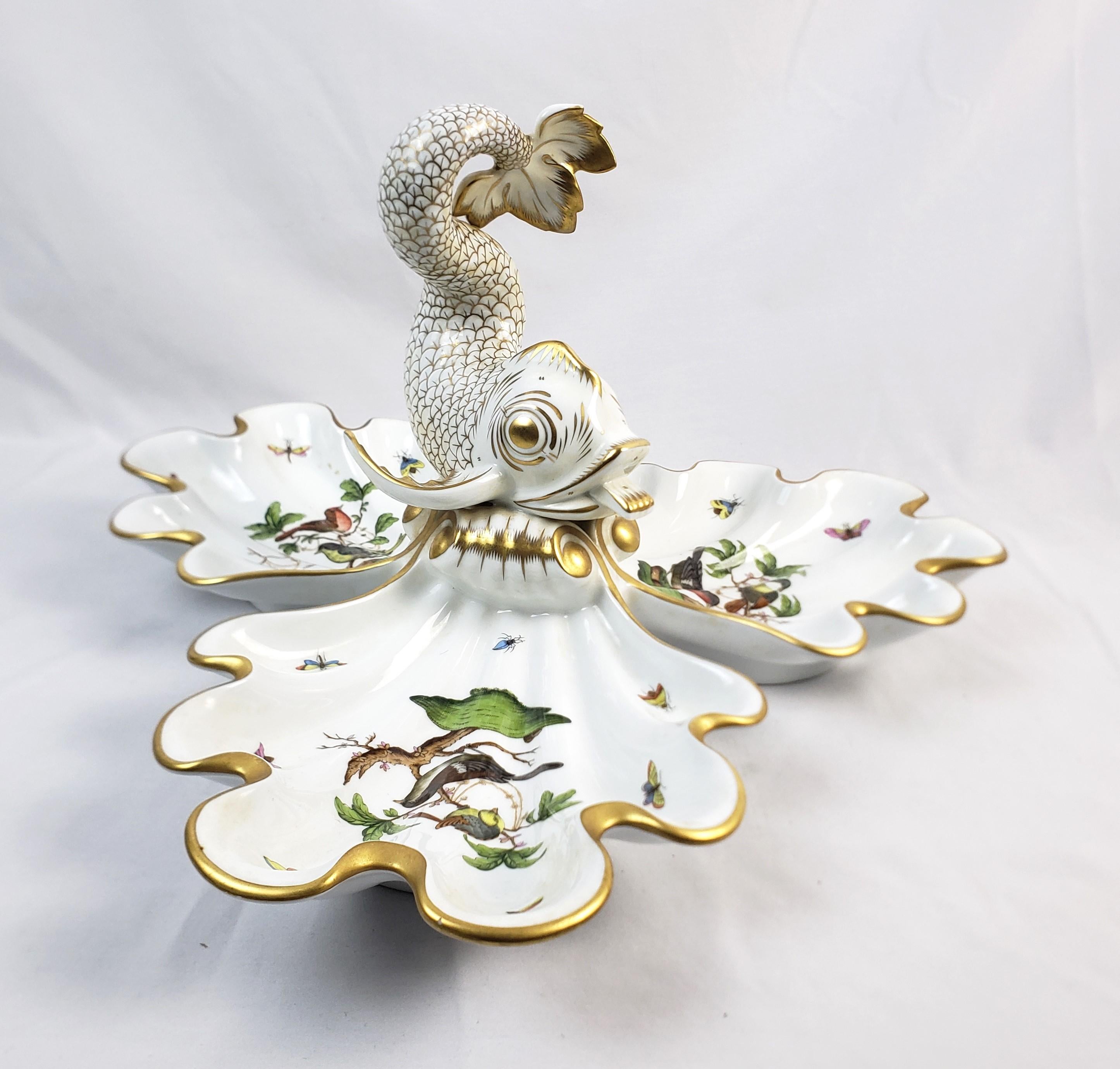 This large vintage centerpiece was made by the well known Herend factory of Hungry and dates to April of 1993 and done in their highly decorative Rothschild Bird pattern. The centerpiece is composed of porcelain and ornately hand-painted with their
