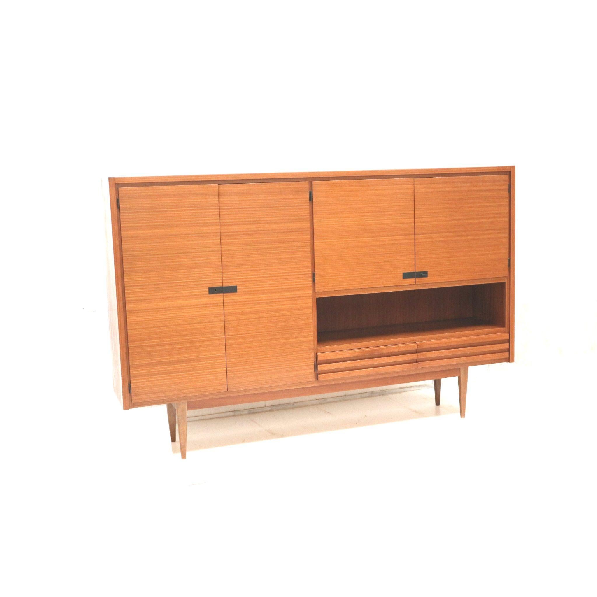 Mid-Century Modern Large vintage highboard sideboard / wall unit made of teak from the 1960s For Sale