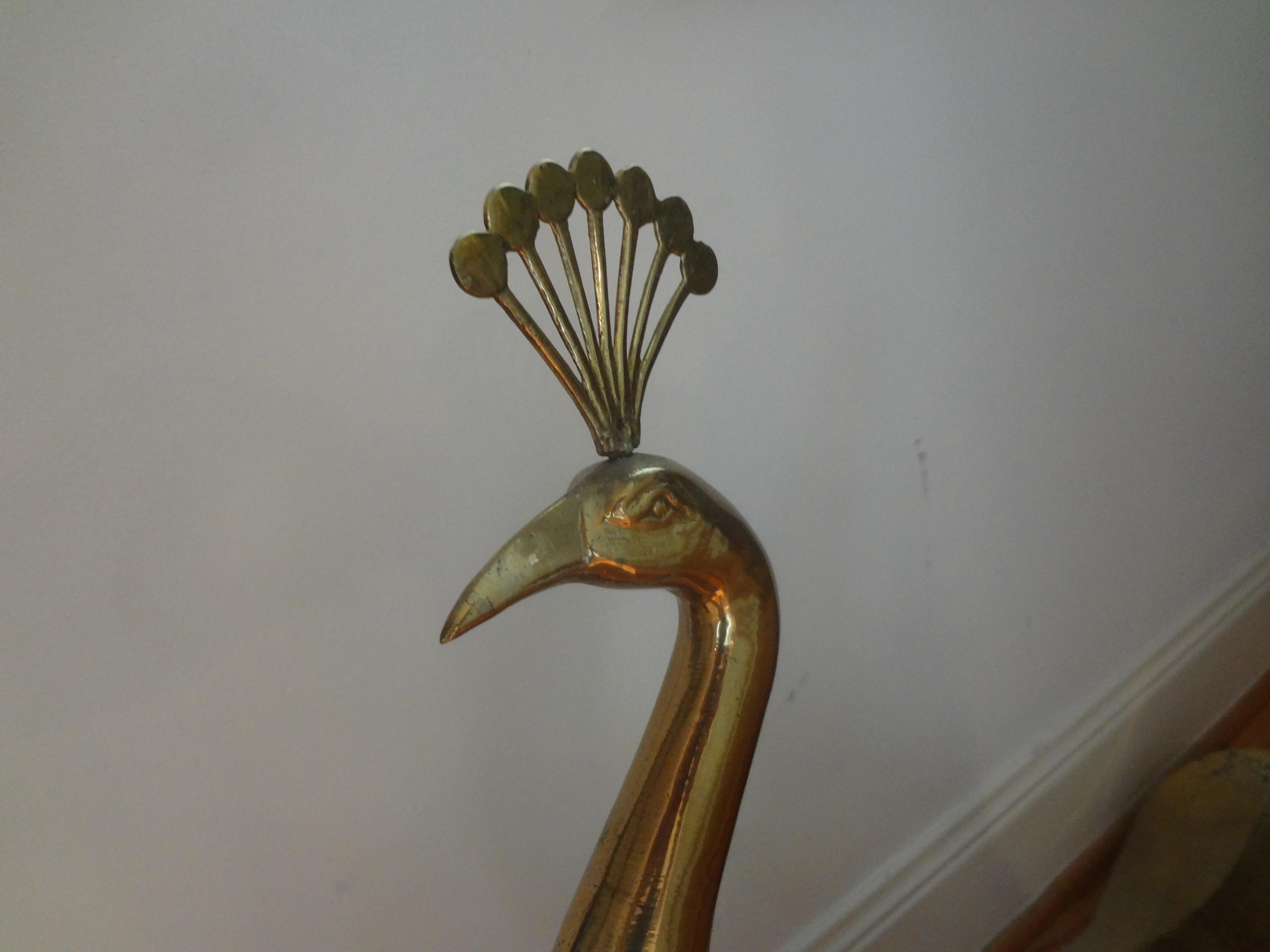 Large Hollywood Regency brass peacock statue or sculpture. This animal statue or figure would make a great addition to a midcentury or Hollywood Regency interior.