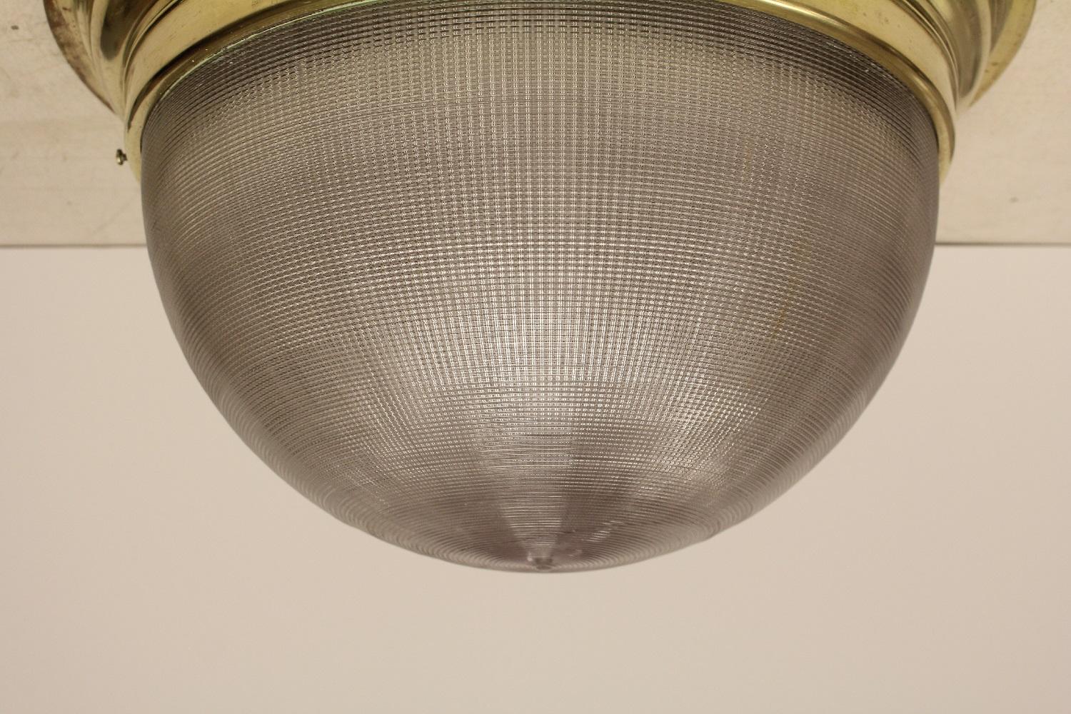 Large vintage Holophane and brass flush mount light. Please note that this listing is per Holophane shade with brass collar. We have 9 available.