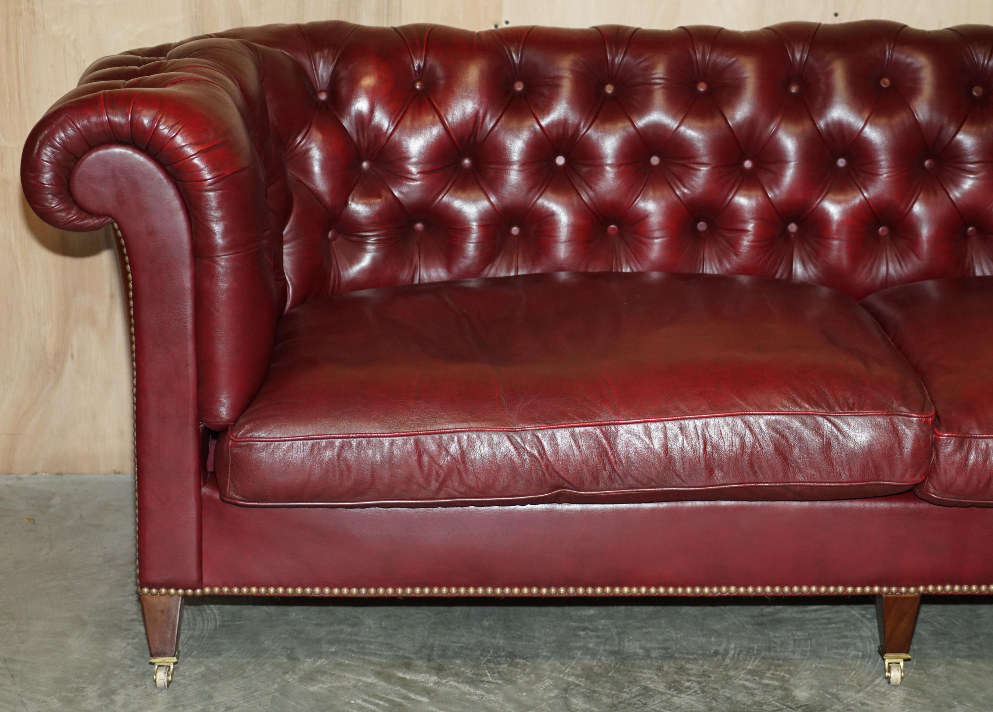 Hand-Crafted Large Vintage Howard & Son's Oxblood Leather Fully Stamped Chesterfield Sofa For Sale