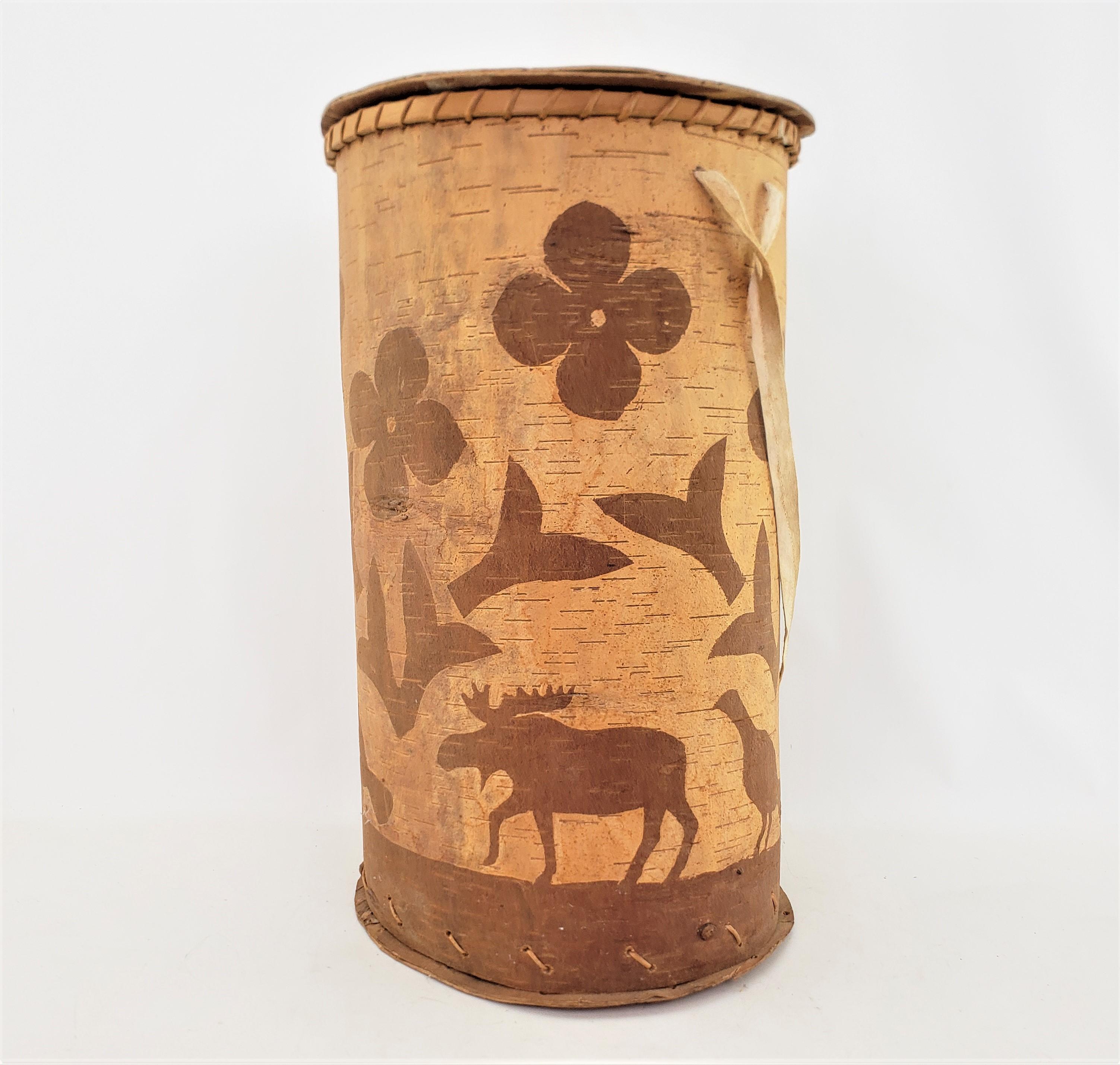 This large hand-crafted basket is unsigned, but presumed to have originated from Canada and date to approximately 1970 and done in the period indigenous Canadian style. This lidded basket is composed entirely of Birch bark which has been