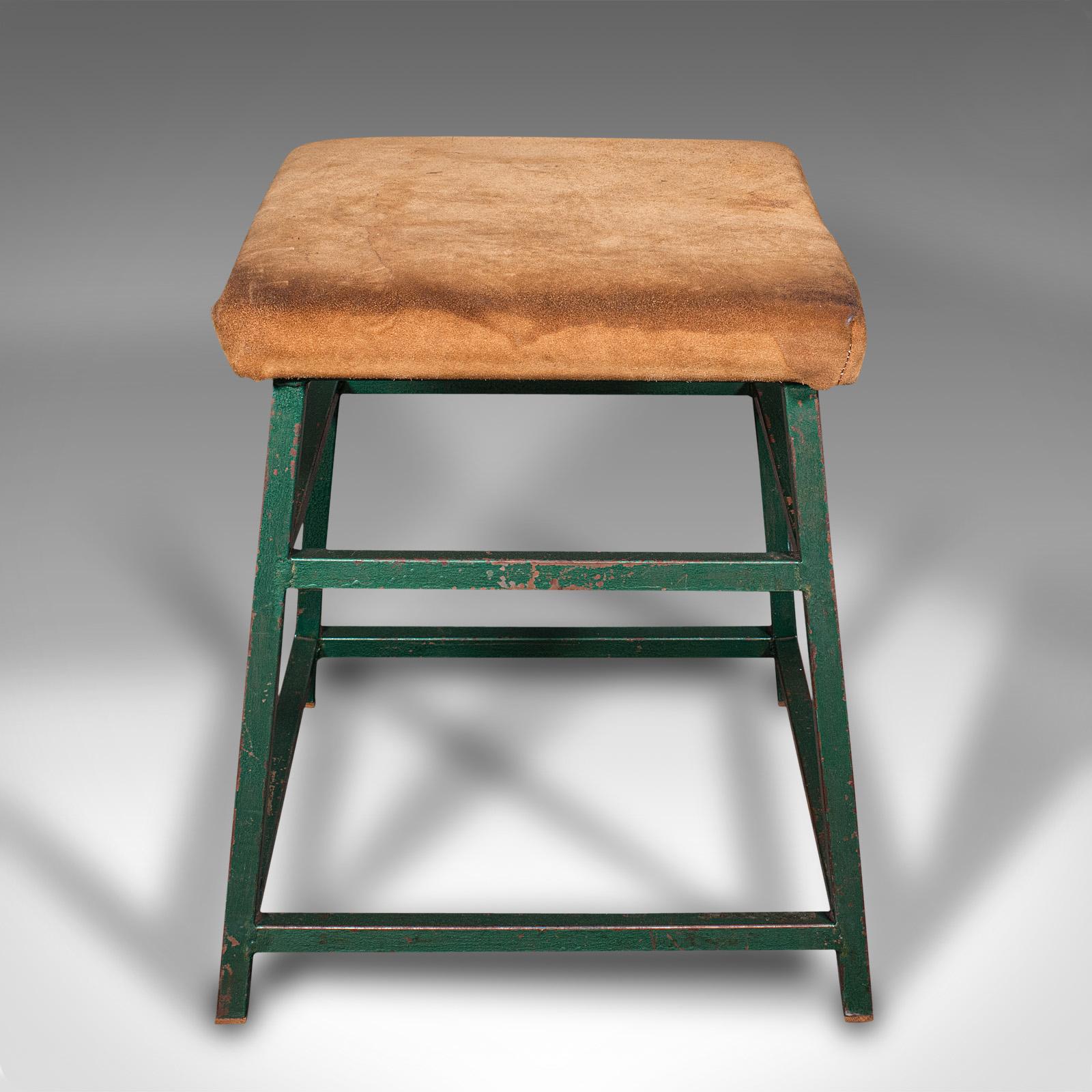 This is a large vintage industrial lab stool. An English, suede and steel kitchen or office seat, dating to the mid 20th century, circa 1950.

Generously proportioned stool with an inherently versatile nature
Displays a desirable aged patina,
