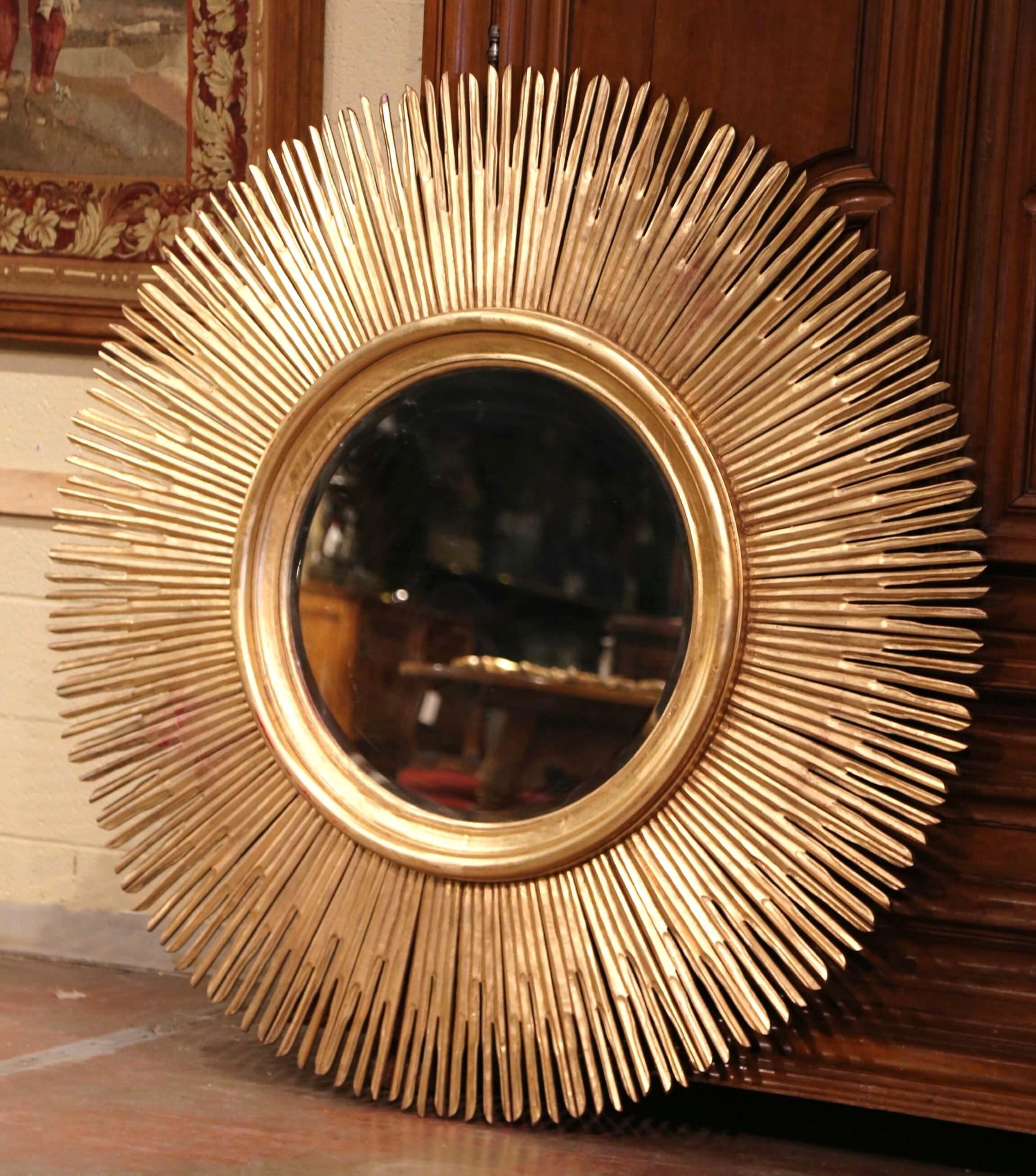 Add a beautiful shine to your home with this important eye-catching sun mirror. Created in Italy circa 2010 and almost five feet in diameter, the large vintage mirror has a classic sunbeam shape with outstretching rays, a central circular beveled