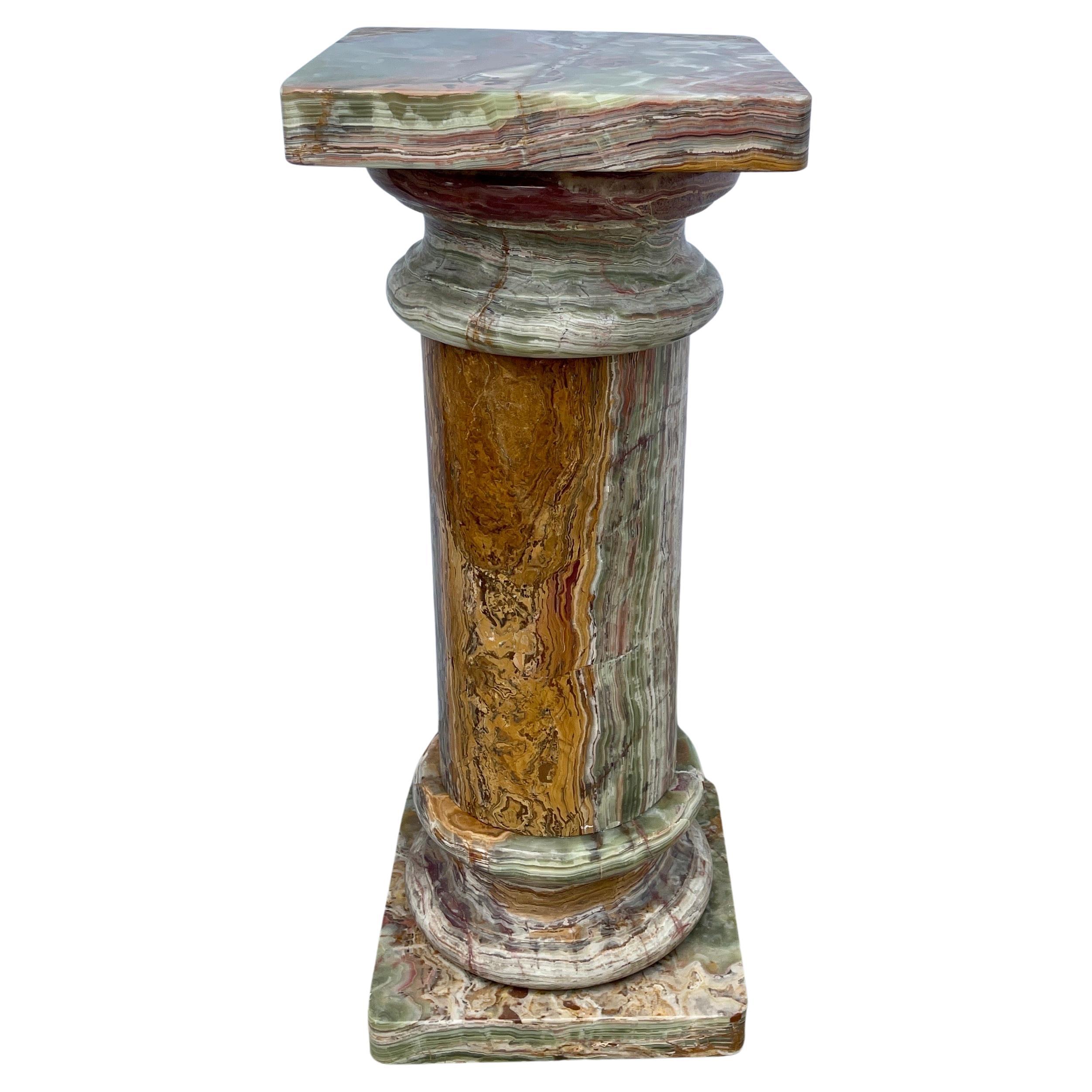 Large 20th Century Turned Onyx Pedestal Marble Column, Italy 1980's.
This amazing five piece pedestal has mostly a green, white and rust colored scheme.
