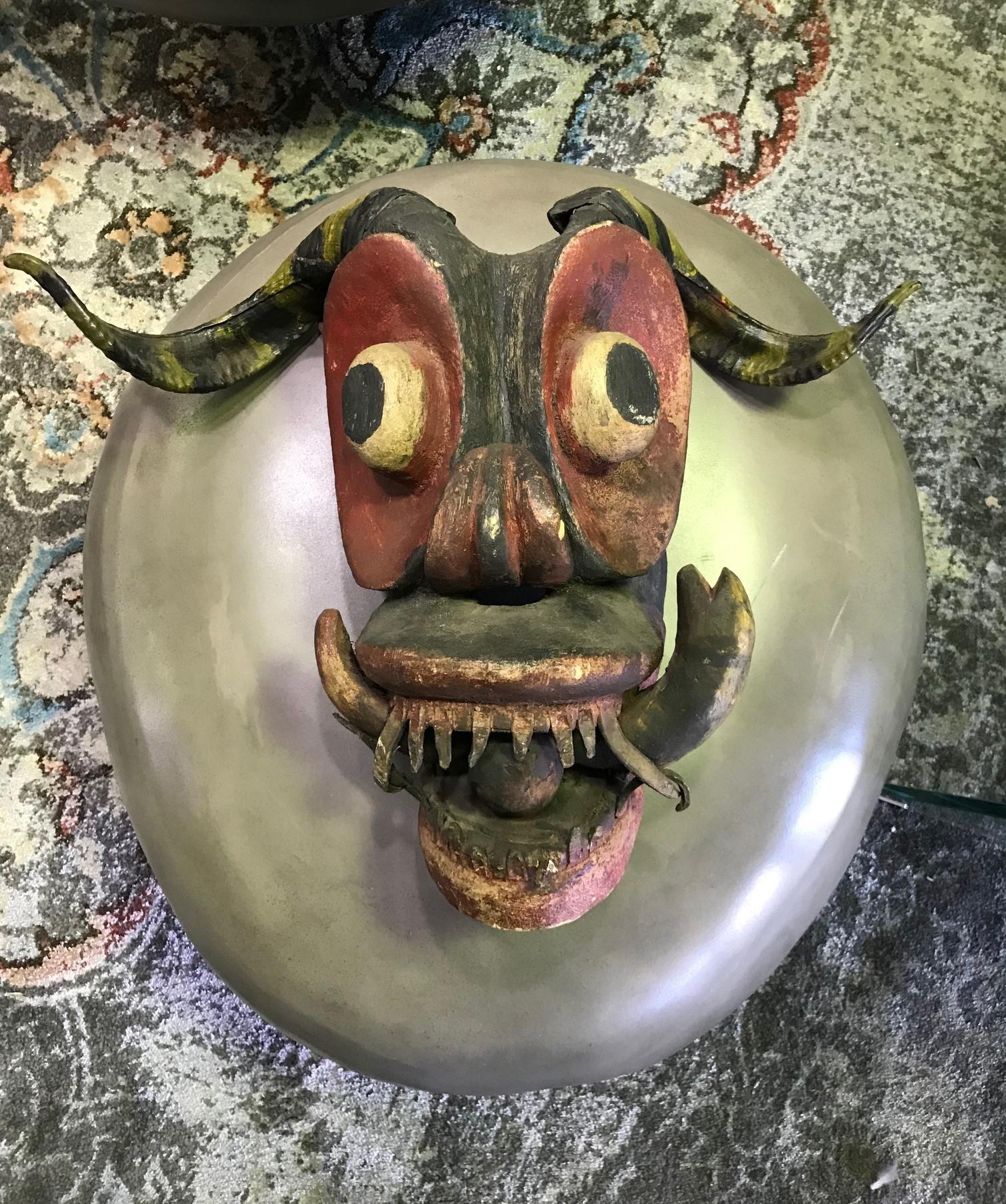 A fantastic piece. Really quite unique. We have not seen another quite like it. 

Made from heavy wood and features real horns. 

Likely South or Central American or perhaps from Mexico.

Has clear signs of use and age so we are estimating