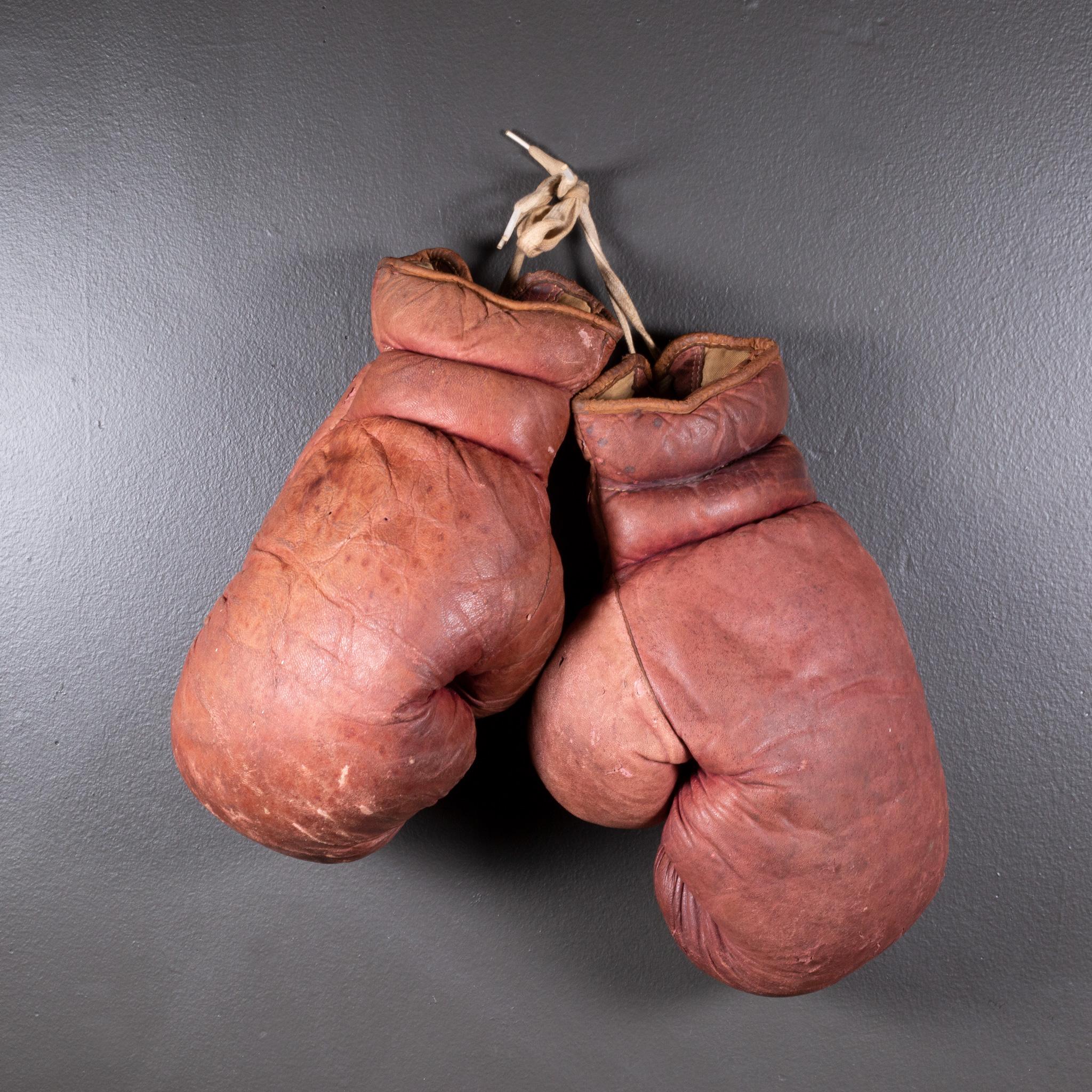 ABOUT

Original boxing gloves with reddish brown leather filled with horse hair. The leather is very soft and in good condition. 

    CREATOR Gold Smith Co.
    DATE OF MANUFACTURE c.1950-1960.
    MATERIALS AND TECHNIQUES Leather, Horse Hair.
   