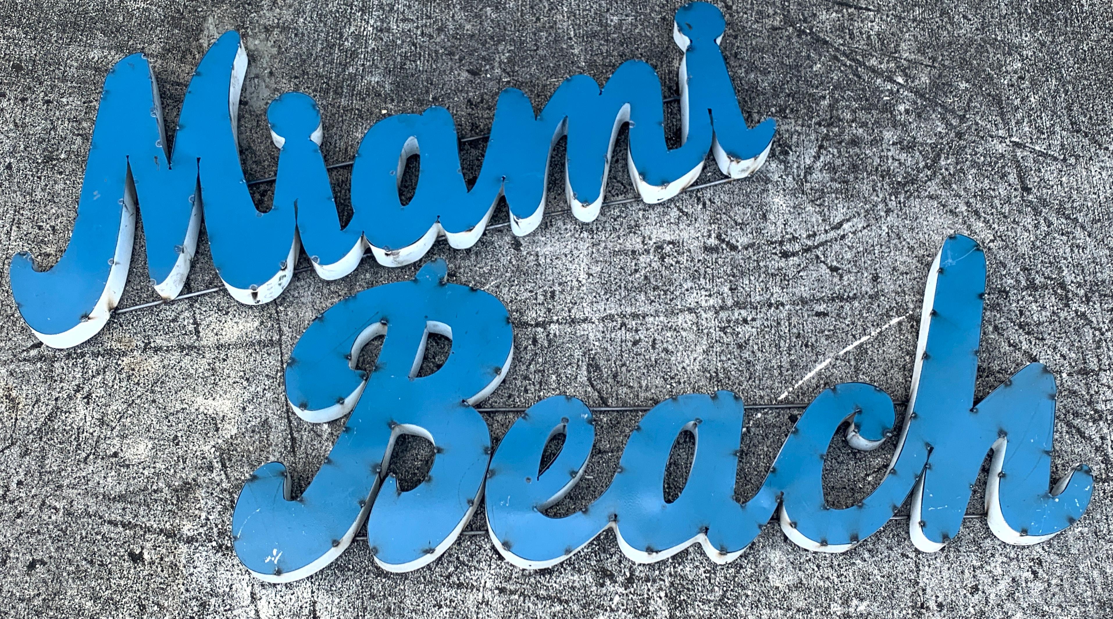 Large vintage 'Miami Beach' enameled metal sign, in two parts
Measures: Miami 47
