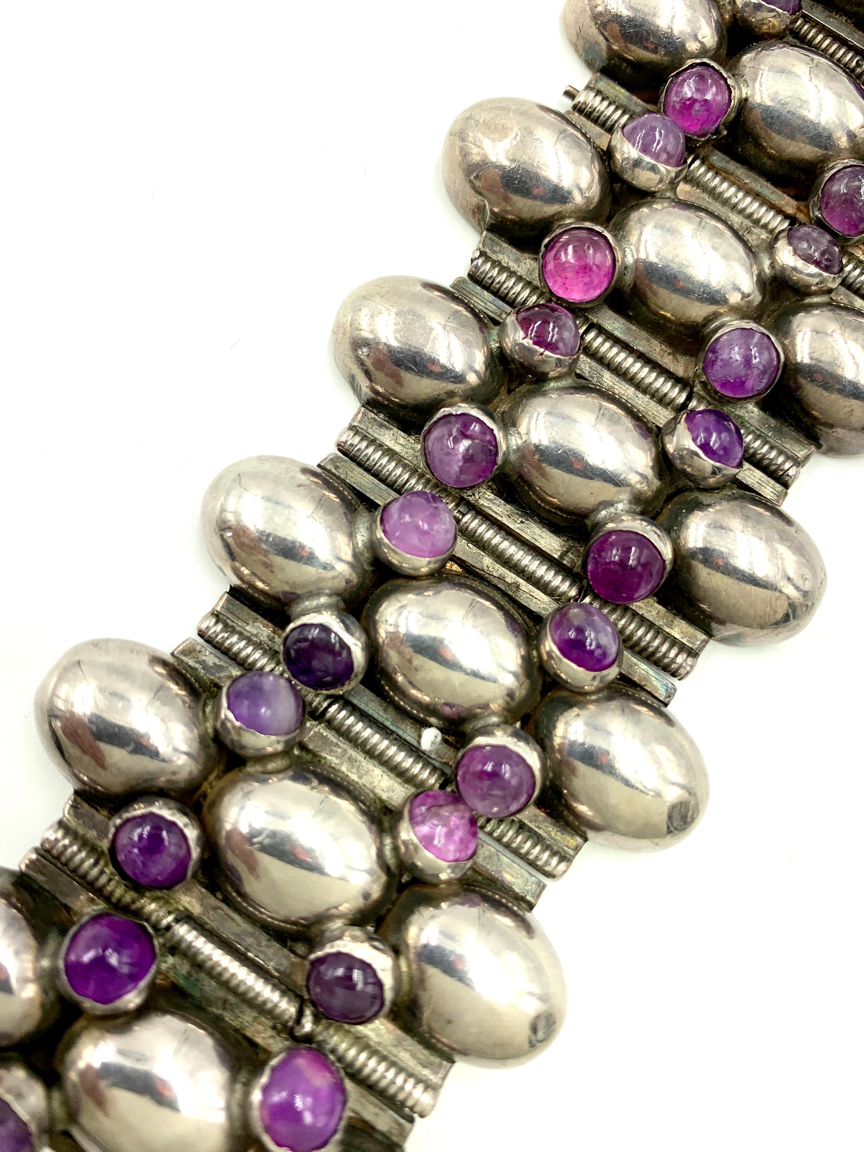Spectacular, exceptionally large signed Fred Davis silver and cabochon Amethyst bracelet
circa 1940
Taxco Mexican Modernist Movement
7.25 inches long, 1.8 inches wide, marked Silver Mexico and FD monogram on back

Frederick W. Davis (1877-1961) was