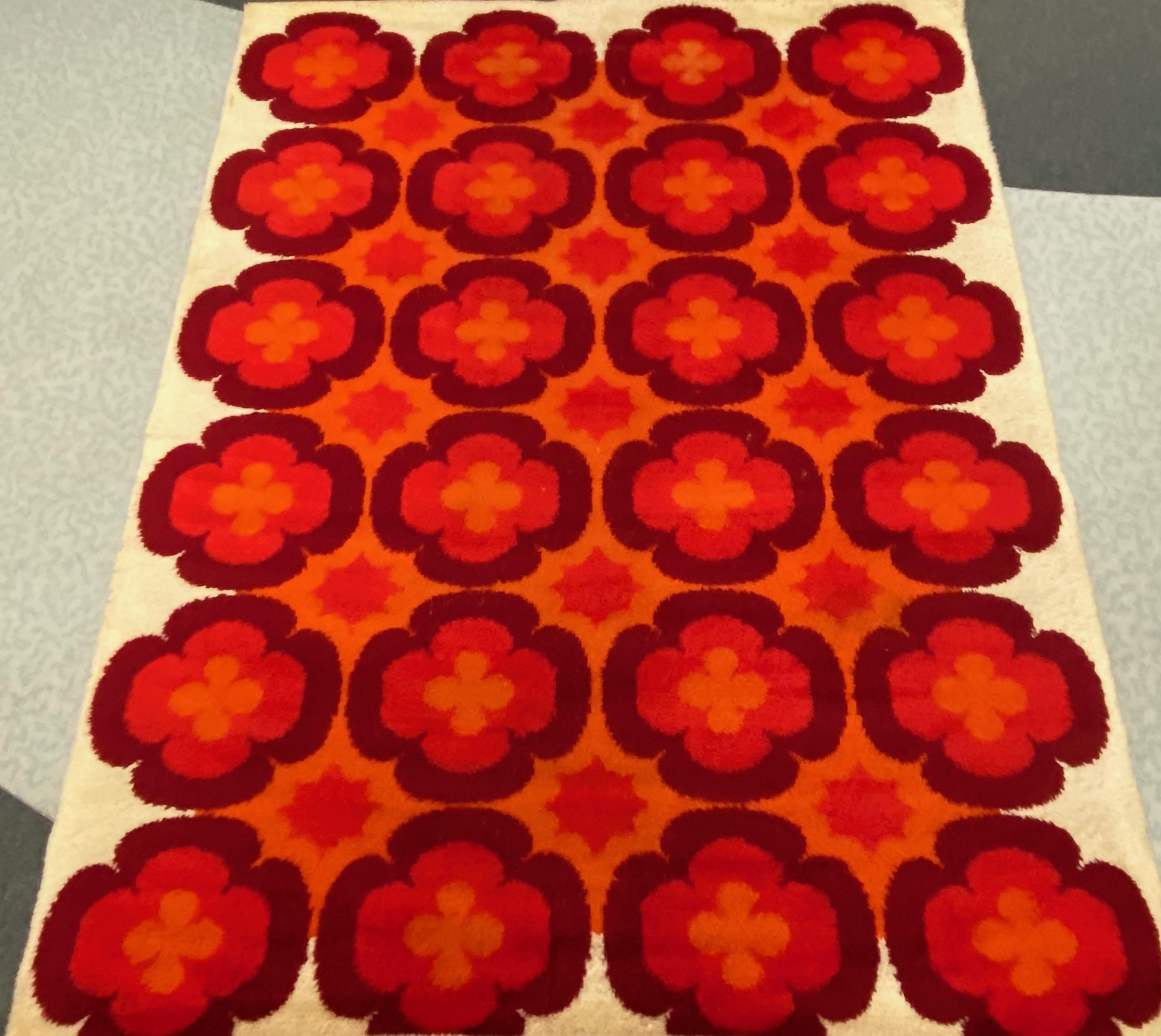 This rug is a great example of 1970s pop art interior. Made in high quality weaving technique. This high quality high pile rug was designed in the 1970s and manufactured in Germany. It is made from wool and it is still in a good vintage condition.