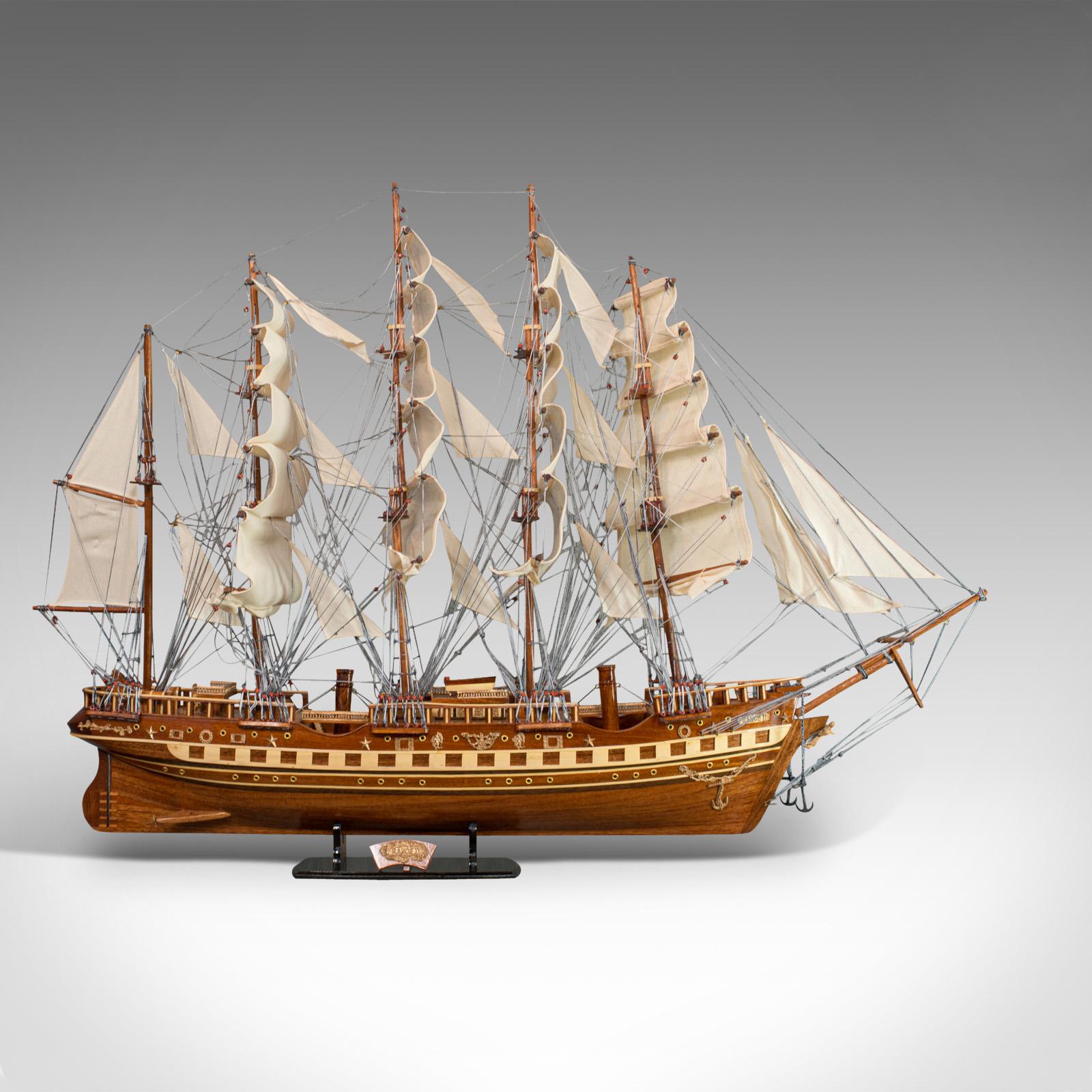 This is a large vintage model of France II. An English, mahogany collectible ship model on display Stand and dating to the 20th century.

France II held the record for the greatest weight capacity of any merchant sailing ship. A five-mast barque