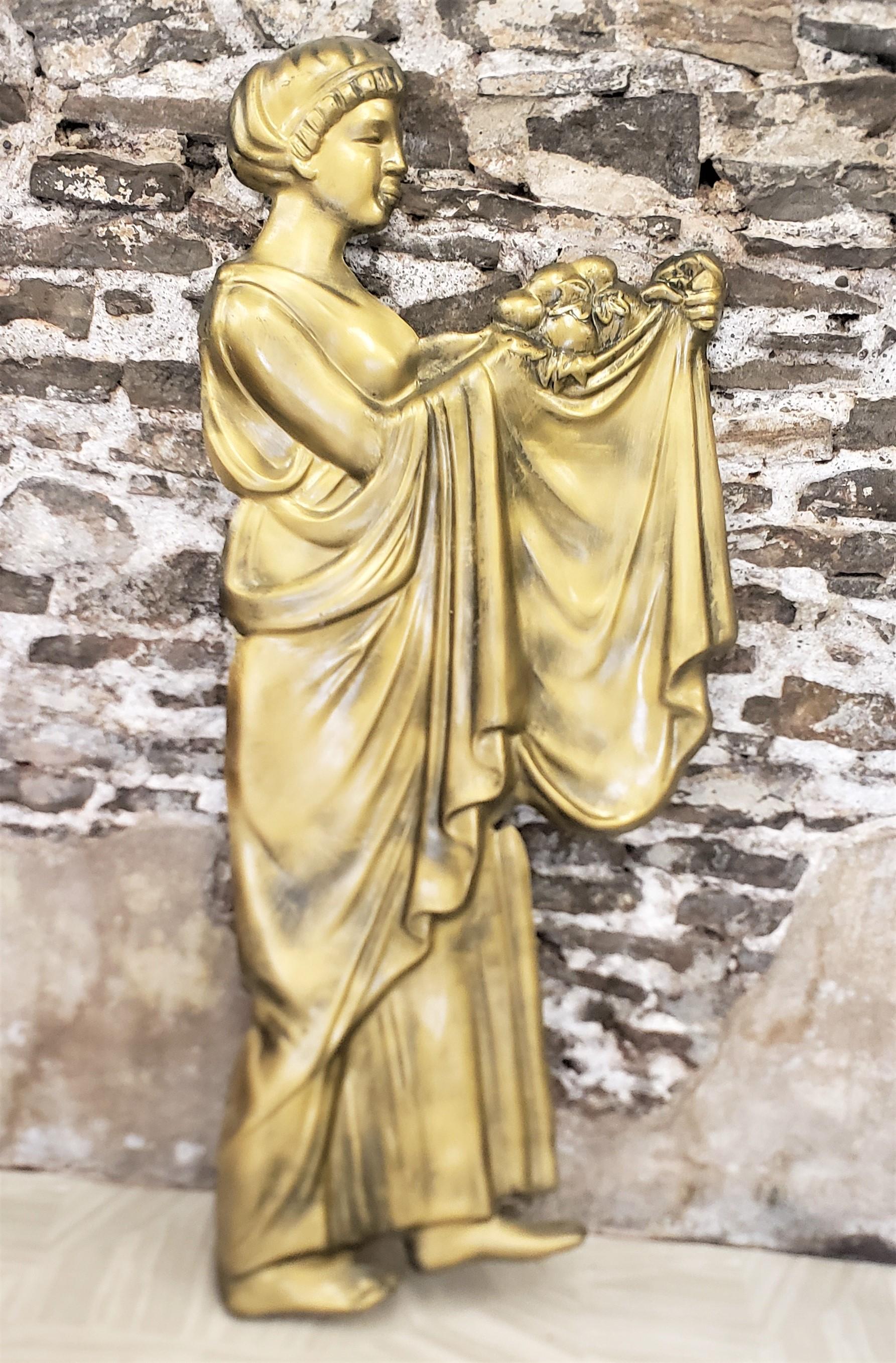 This mid-century era molded fiberglass wall sculpture is unsigned, but presumed to have been made in Canada in approximately 1960 in a Neoclassical Revival style. The relief depicts a seminude young female with long flowing robes, carrying a bowl or