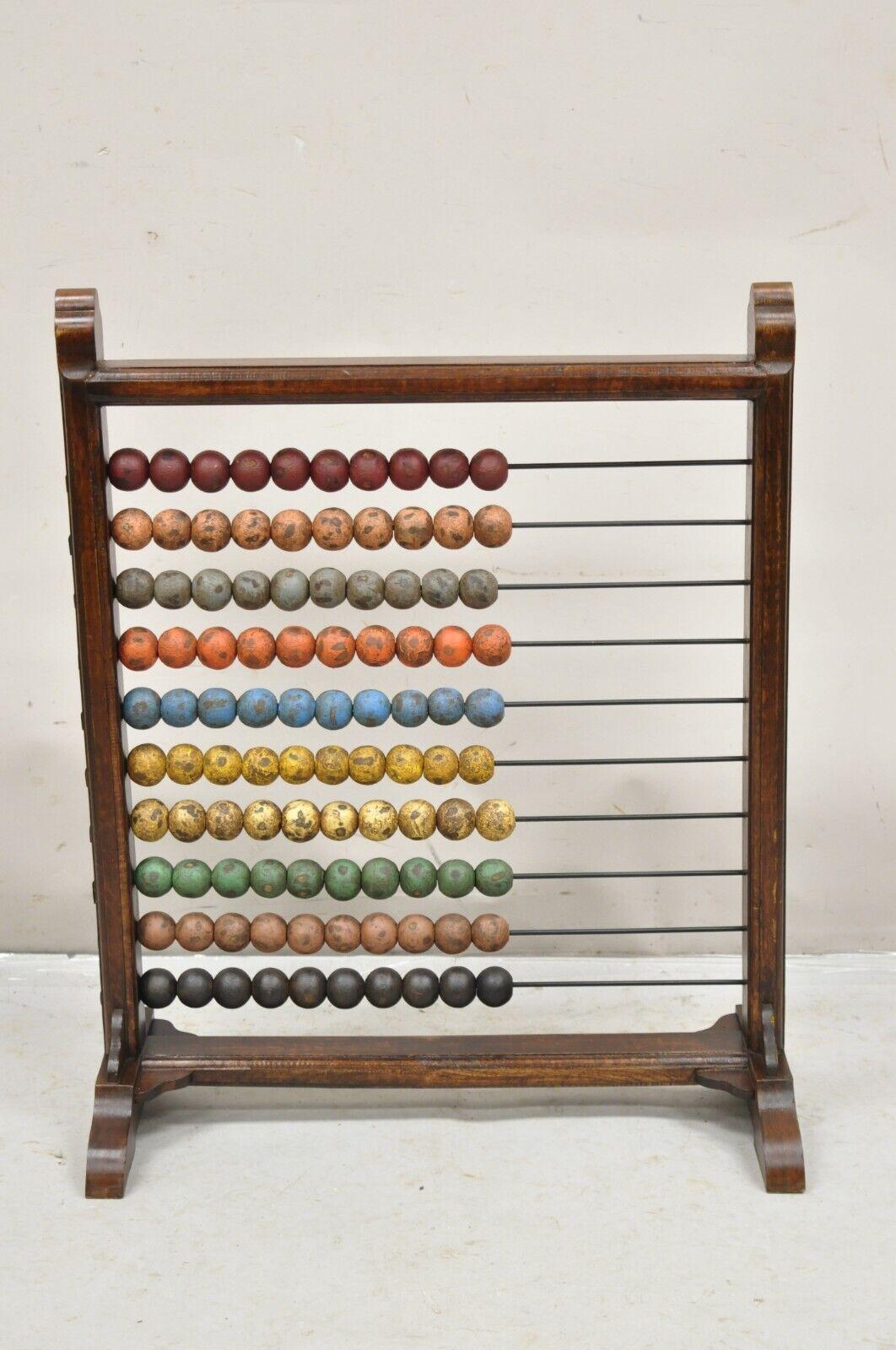 Large Vintage Mongolian Wooden Math Abacus with Painted Wooden Balls. Item features Painted wooden balls in red, pink, gray, orange, blue, yellow, green and brown. Circa Mid 20th Century, possibly older (age undetermined. Measurements: 28.5