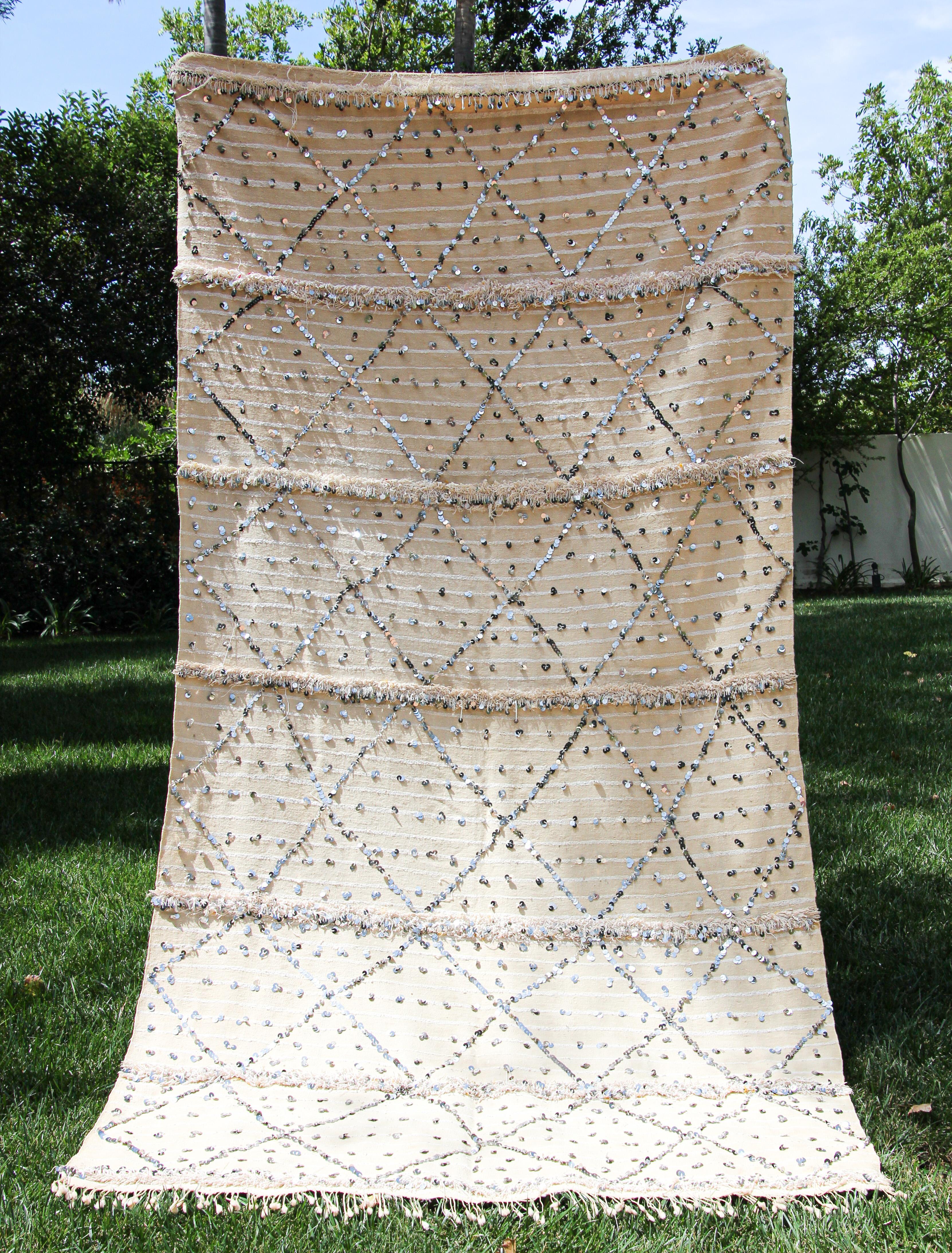 Very large vintage original tribal Moroccan wedding Berber women shawl, blanket, throw.
The Zaiane tribal shawls incorporate quantities of sequins in their design to achieve an impressive decorative effect on the alternate stripes of wool and cotton