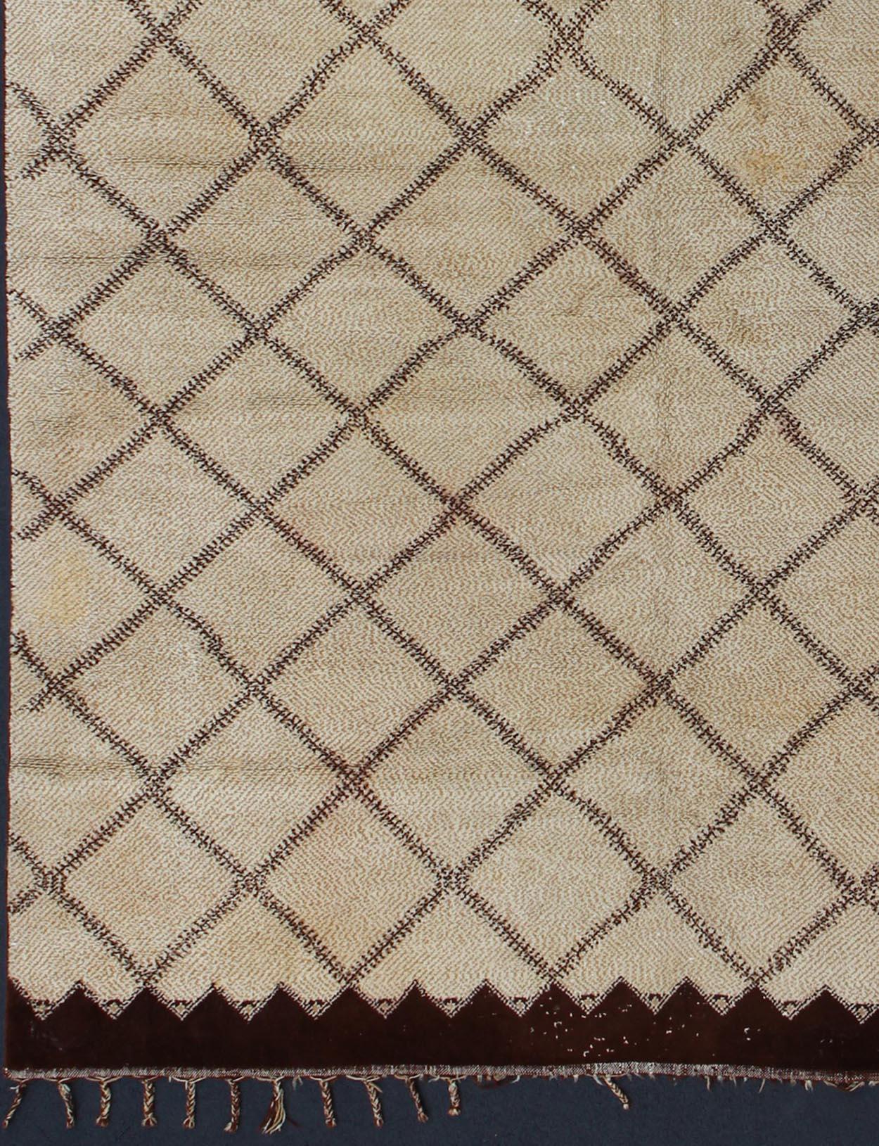 Ivory background color large size vintage Moroccan Beni Ourain rug , Country of Origin Morocco / rug type: Morocco, circa date: Mid - 20th century, this vintage midcentury Moroccan rug is in nearly excellent condition is unique in size. This rug is