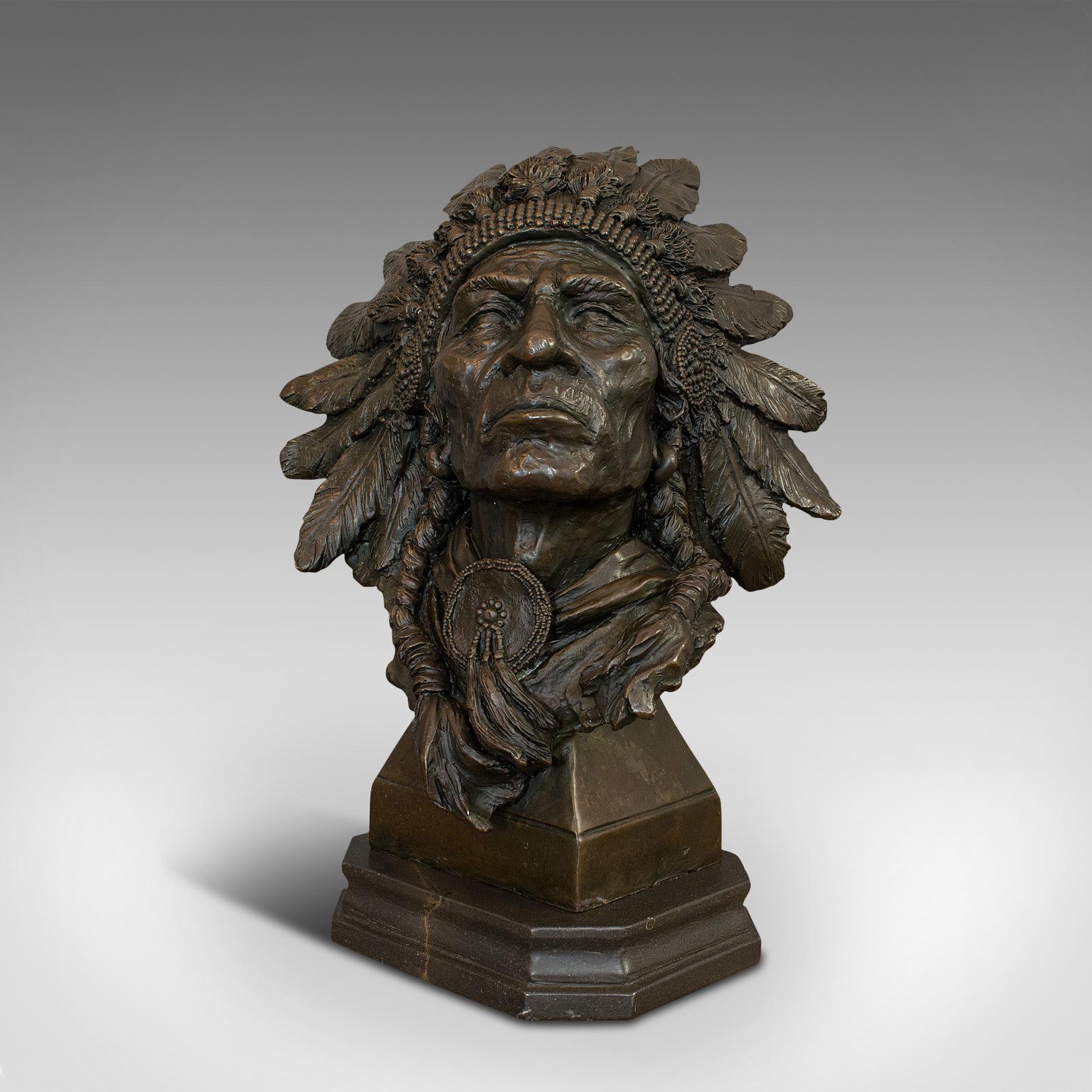 This is a large, vintage Native American chief bust. A Continental, bronze sculpture of a Sioux male in the manner of Carl Kauba (1865-1922), dating to the 20th century.

Superior weight and detail to this regal piece
Displays a desirable aged