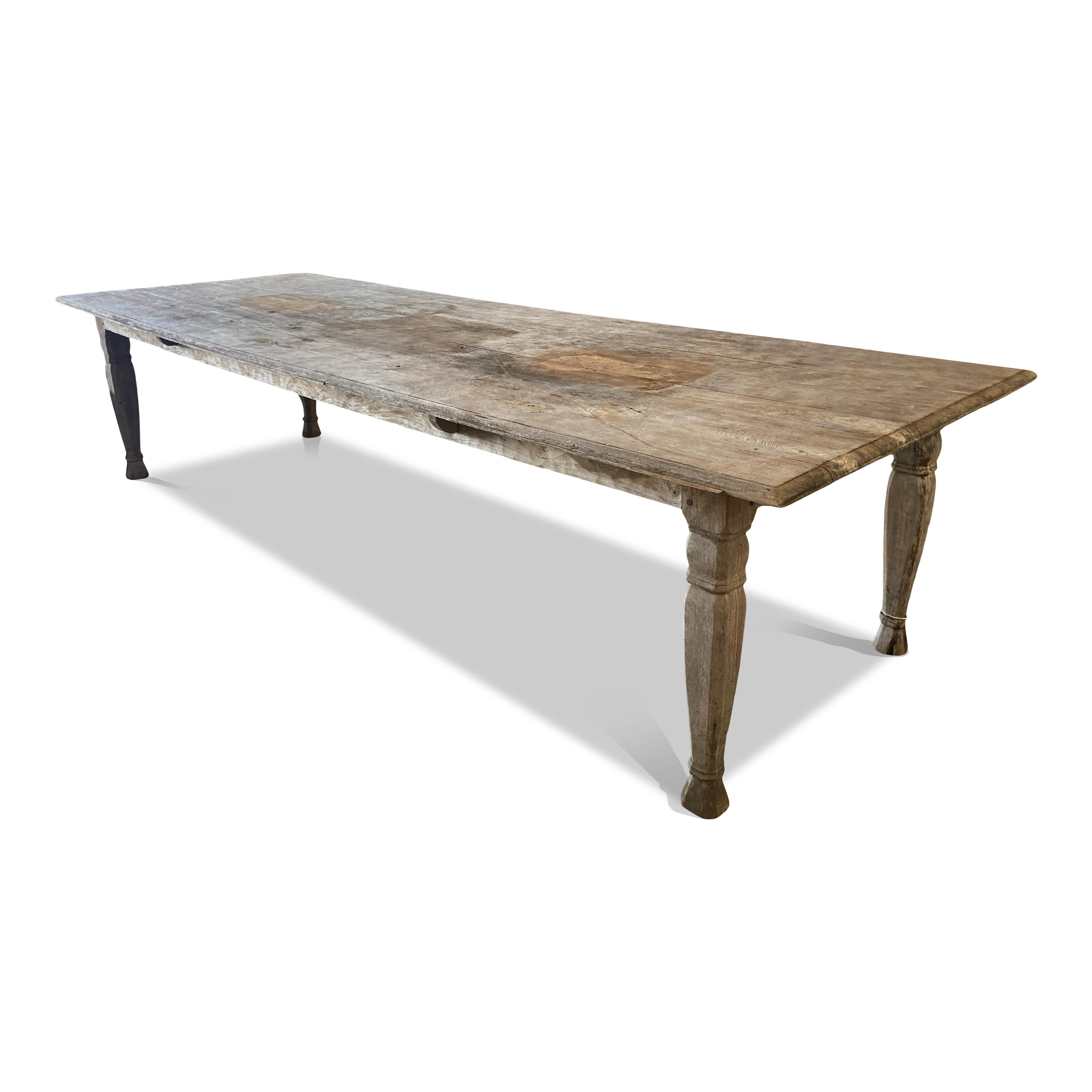 This Large Vintage Oak Farmhouse Table is a timeless classic, perfect for adding a touch of rustic elegance to your interior. Crafted from solid oak, it is both spacious and durable, providing a stylish yet functional piece that will stand the test