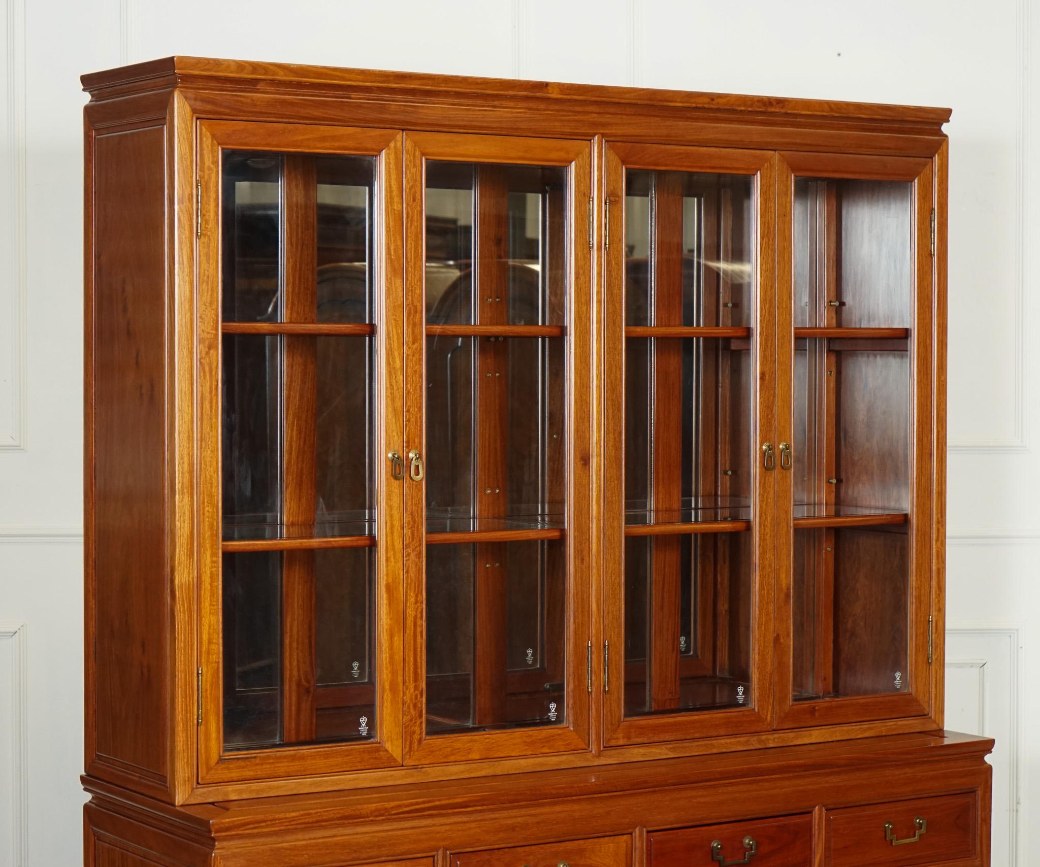 
We are delighted to offer for sale this Large Vintage Oriental Chinese Carved Solid Hardwood Bookcase Display Cabinet.

 A magnificent piece of furniture that exudes timeless elegance and intricate craftsmanship. Crafted from solid hardwood, this