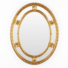 Large vintage oval Neo-Classical style gilt framed mirror by Deknudt