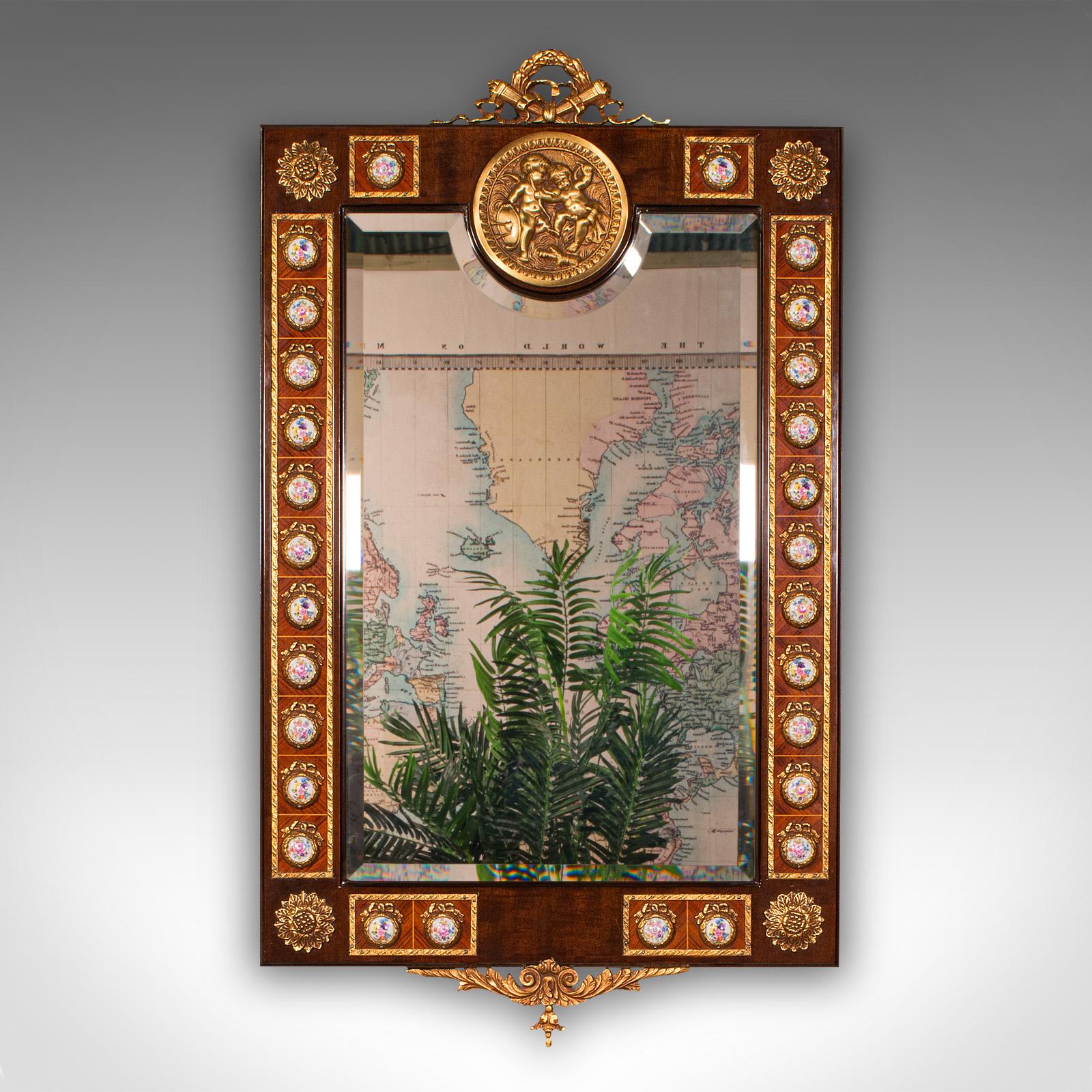 This is a large vintage overmantle mirror. A Continental, walnut decorative mirror in Italianate taste, dating to the late 20th century, circa 1970.

Strikingly ornate, with superb craftsmanship and highly distinctive
Displaying a desirable aged