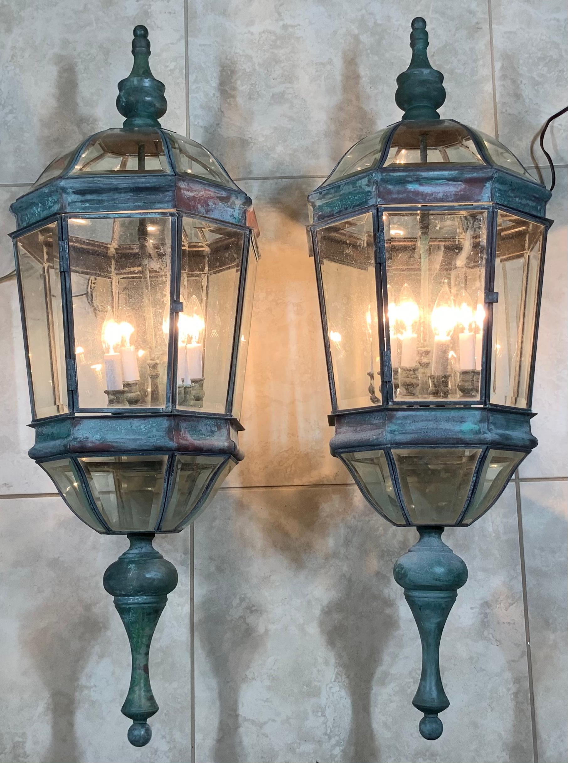 Exceptional large pair of wall lantern made of solid brass, quality workmanship, electrified with four 40/watt light each, beautiful beveled glass. Great light exposure.
Suitable for wet location.
Great patina decorative pair of lantern for indoor