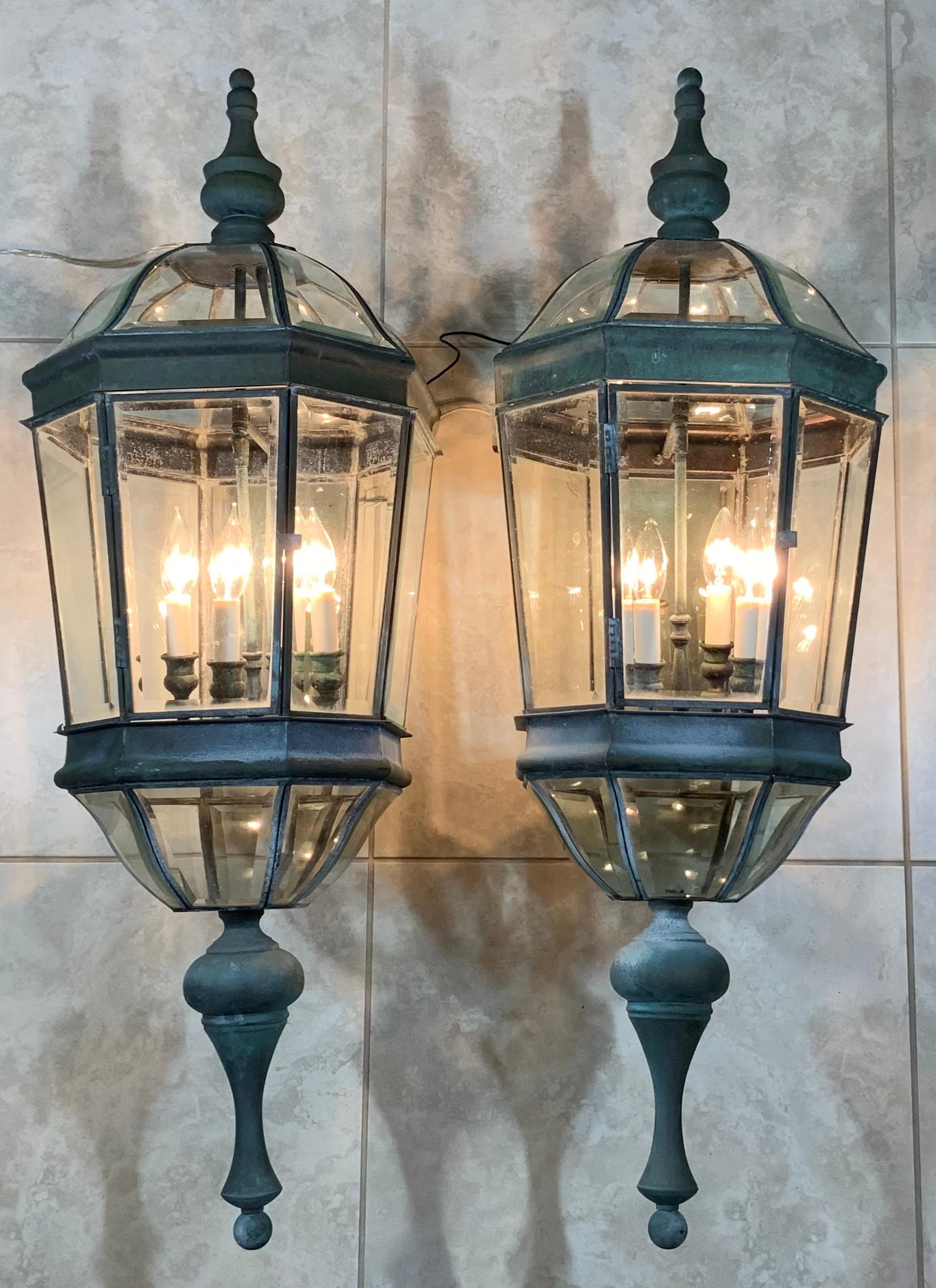 Exceptional large pair of wall lantern made of solid brass, quality workmanship, electrified with four 40/watt light each, beautiful beveled glass. Great light exposure.
Suitable for wet location. Penny size crack in the upper right glass on the
