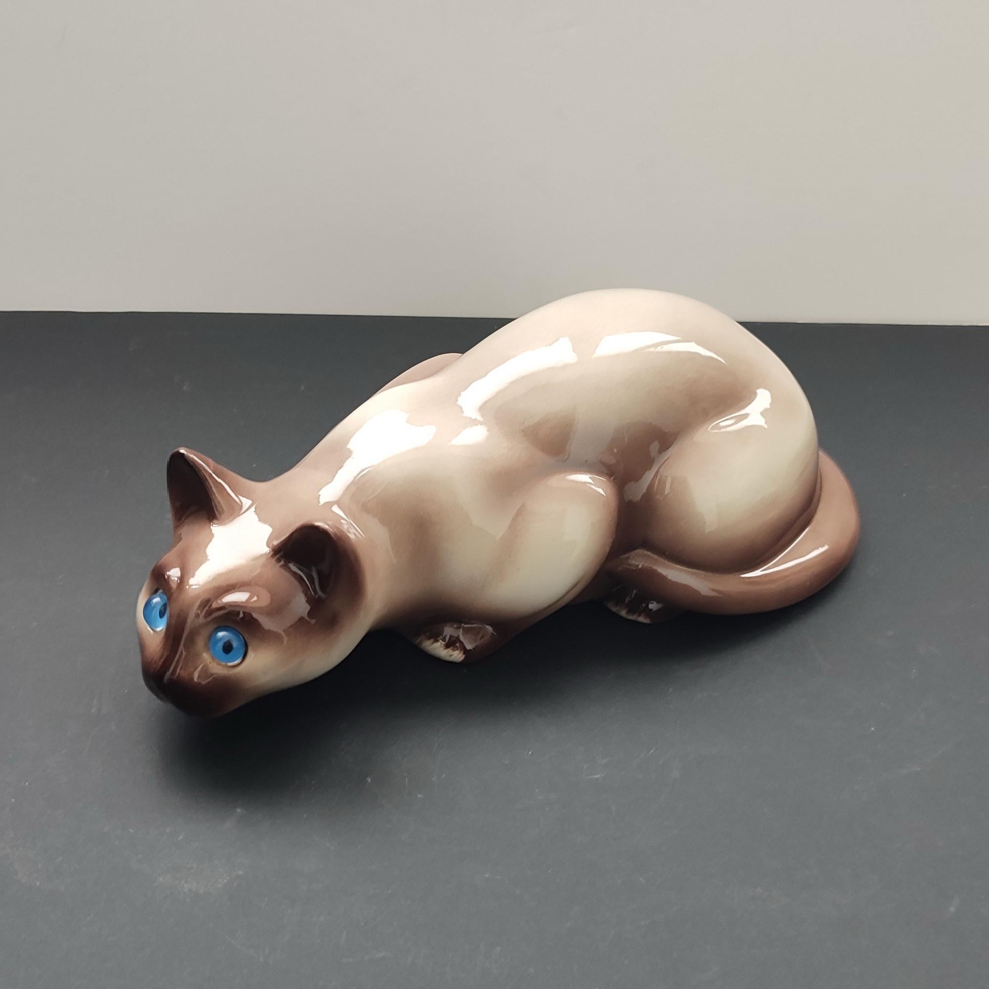pottery cats with glass eyes