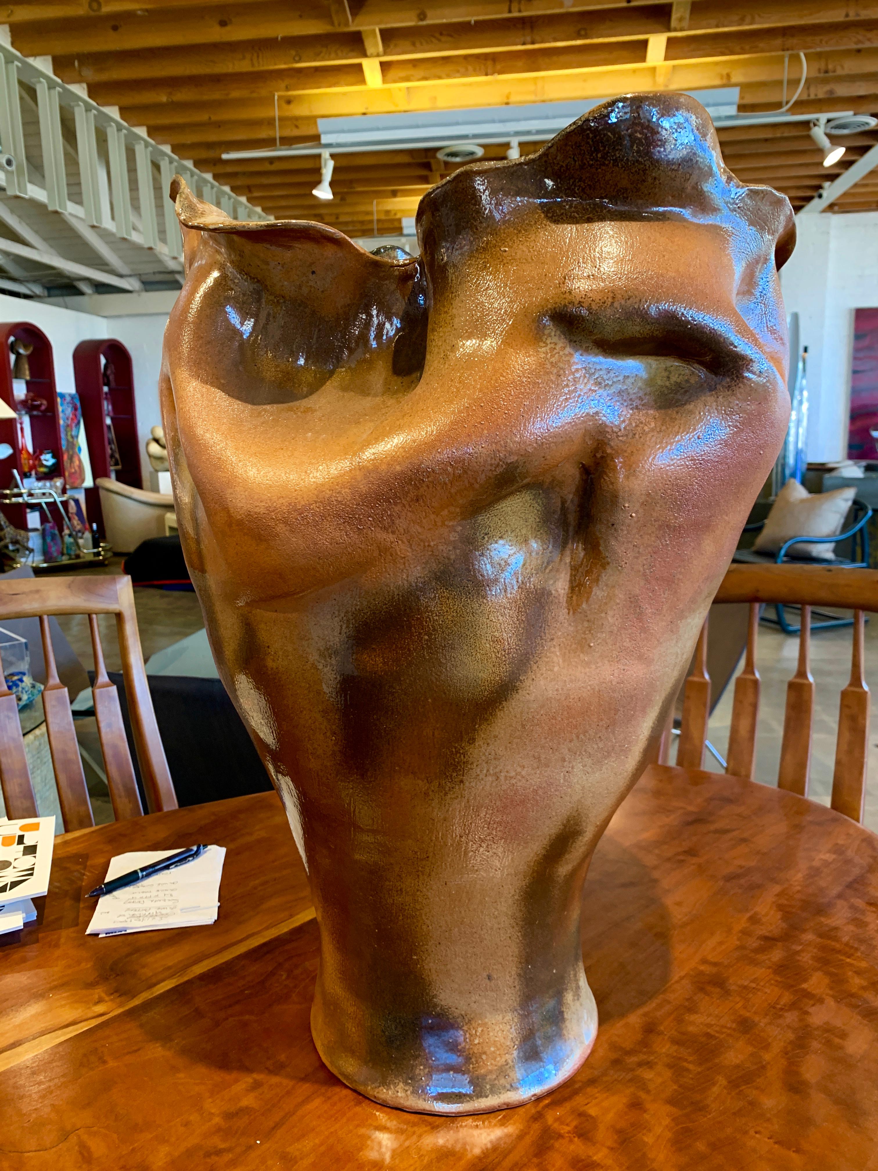 An extremely well executed large pottery vessel attributed to Paul Soldner one of the first students of Peter Voulkos. He was a master of Raku and low temperature salt firing. This vessel is large, approximately 24 inches tall. It has a beautiful