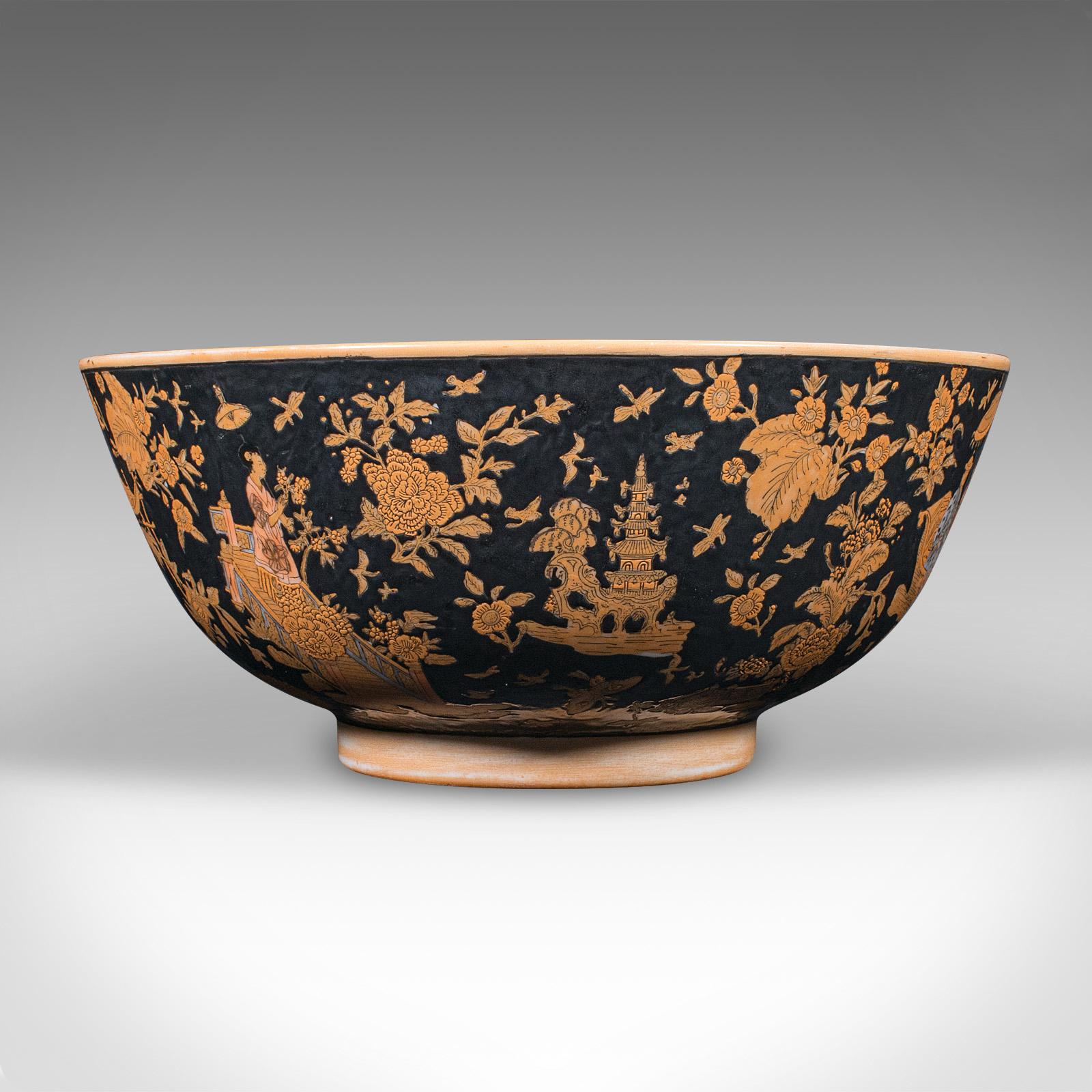 
This is large a vintage punch bowl. A Chinese, ceramic fruit dish or planter, dating to the Art Deco period, circa 1940.

Charming Oriental taste to this pleasingly substantial punch bowl
Displays a desirable aged patina and in good original