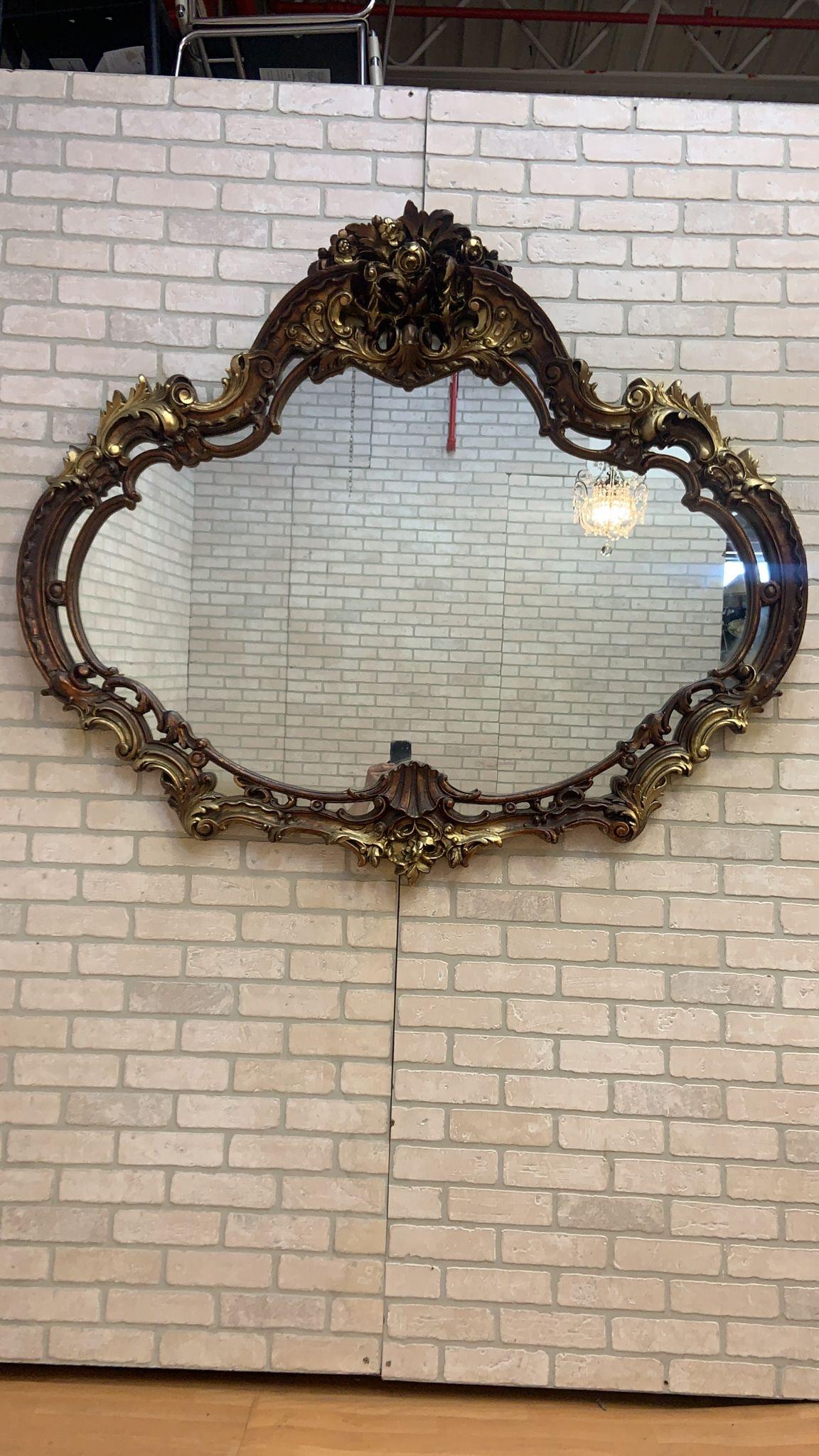 Vintage Rococo Revival Style Carved Wall Mirror

The Vintage Rococo Revival Style Wall Mirror is a stunning embodiment of the Rococo Revival aesthetic.

The frame is adorned with lavish scrolls, elaborate foliage, and asymmetrical details, which are