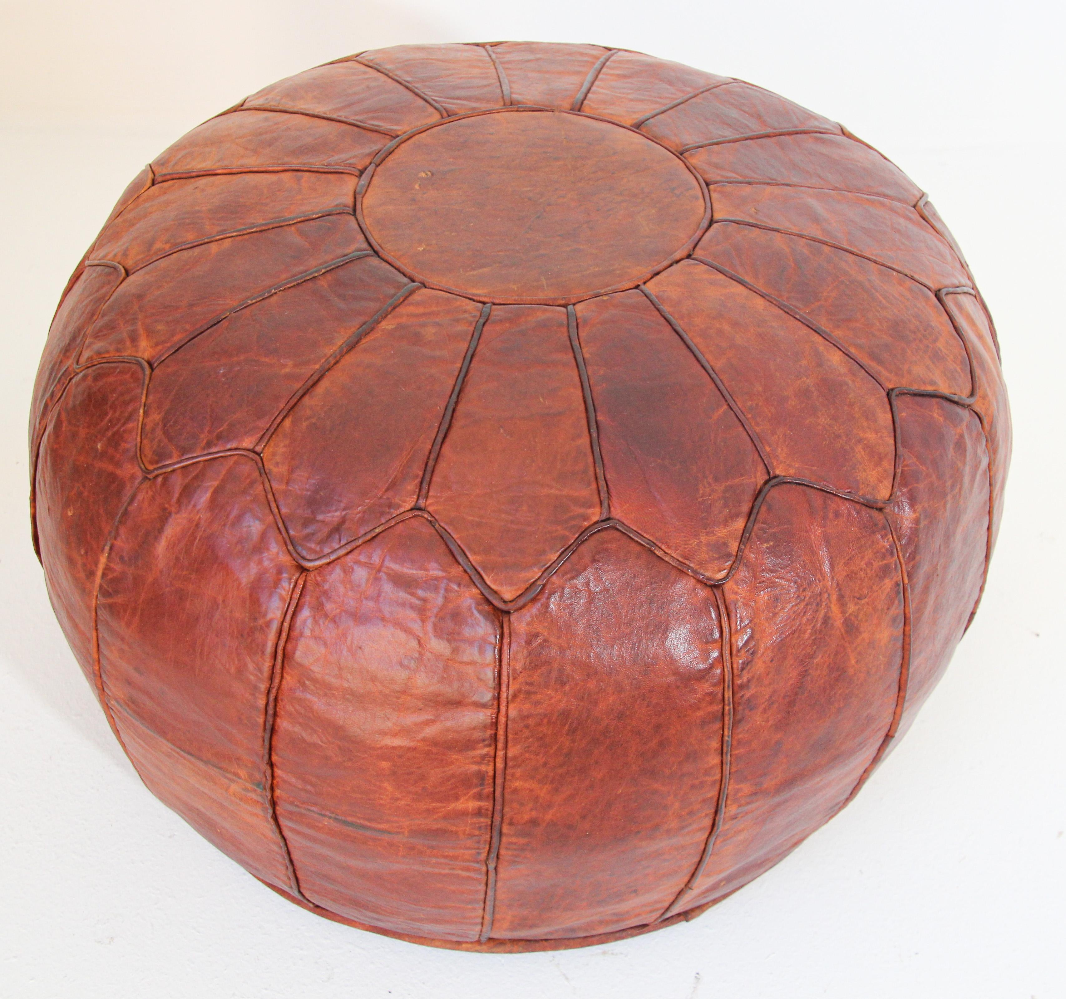 Large vintage round Moroccan leather pouf, handcrafted in brown camel leather.
Hand tooled leather stool ottoman handcrafted by Moroccan artisans in Marrakech, Morocco.

    