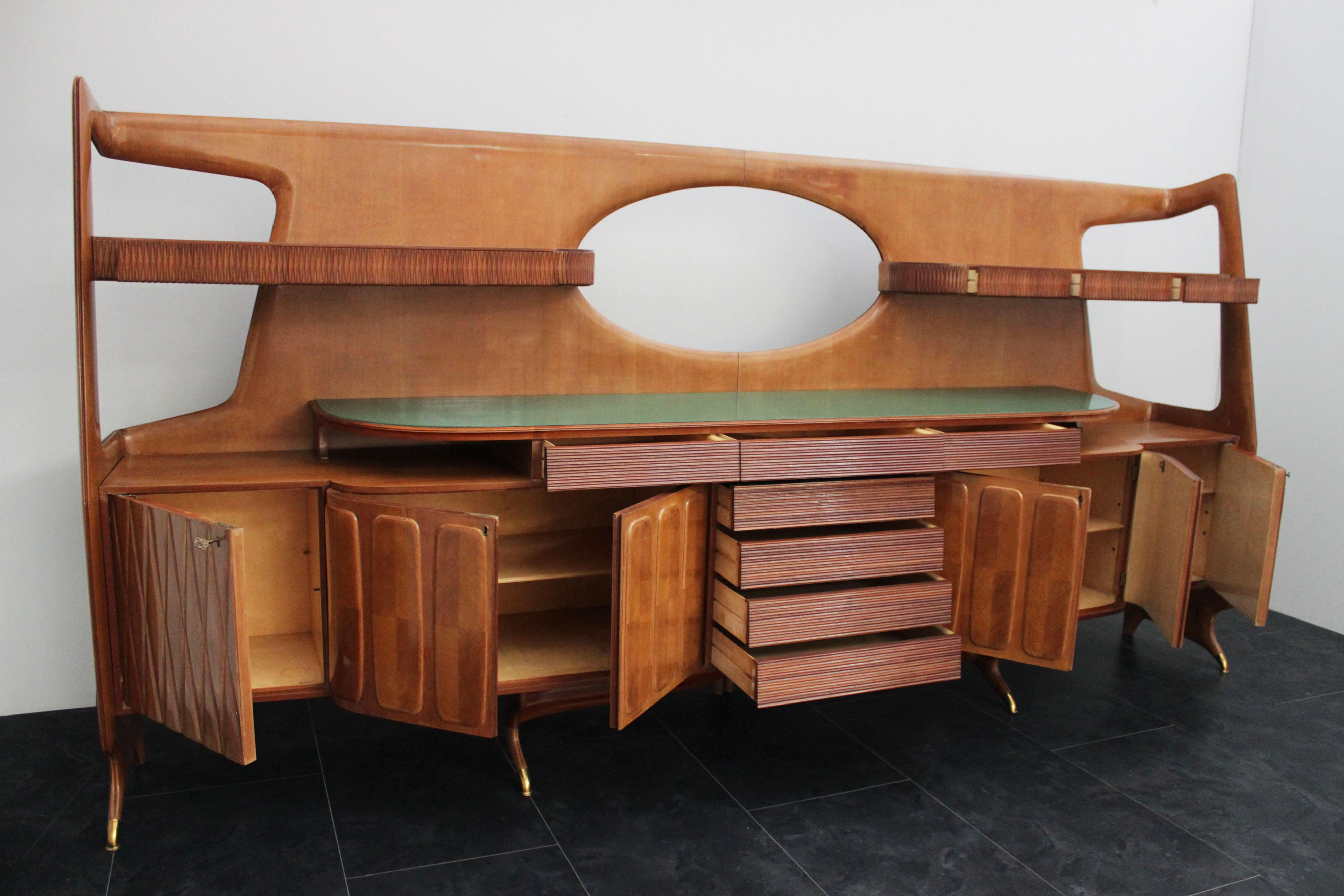 Cabinet of great cabinetry, body in curved and shaped solid cherry doors and drawers covered in solid and carved: upper drawers with small rhombuses, central drawers with breadstick, side doors with rhombuses to follow rusticated doors with bevelled
