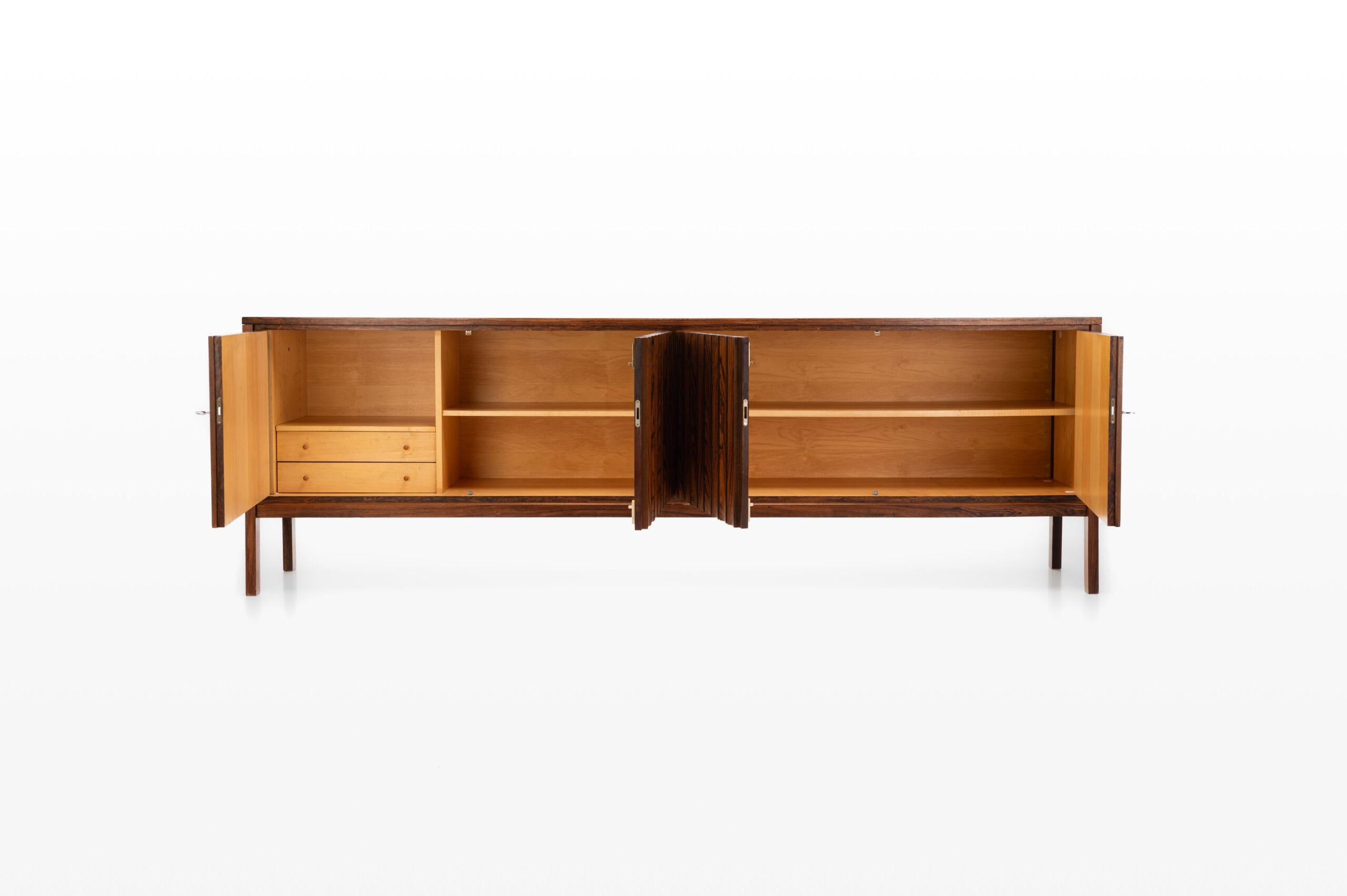 Vintage rosewood sideboard designed by Leo Bub in the 1970s. Produced by Bub Wertmöbel in Germany. The sideboard is in very good original condition.
 