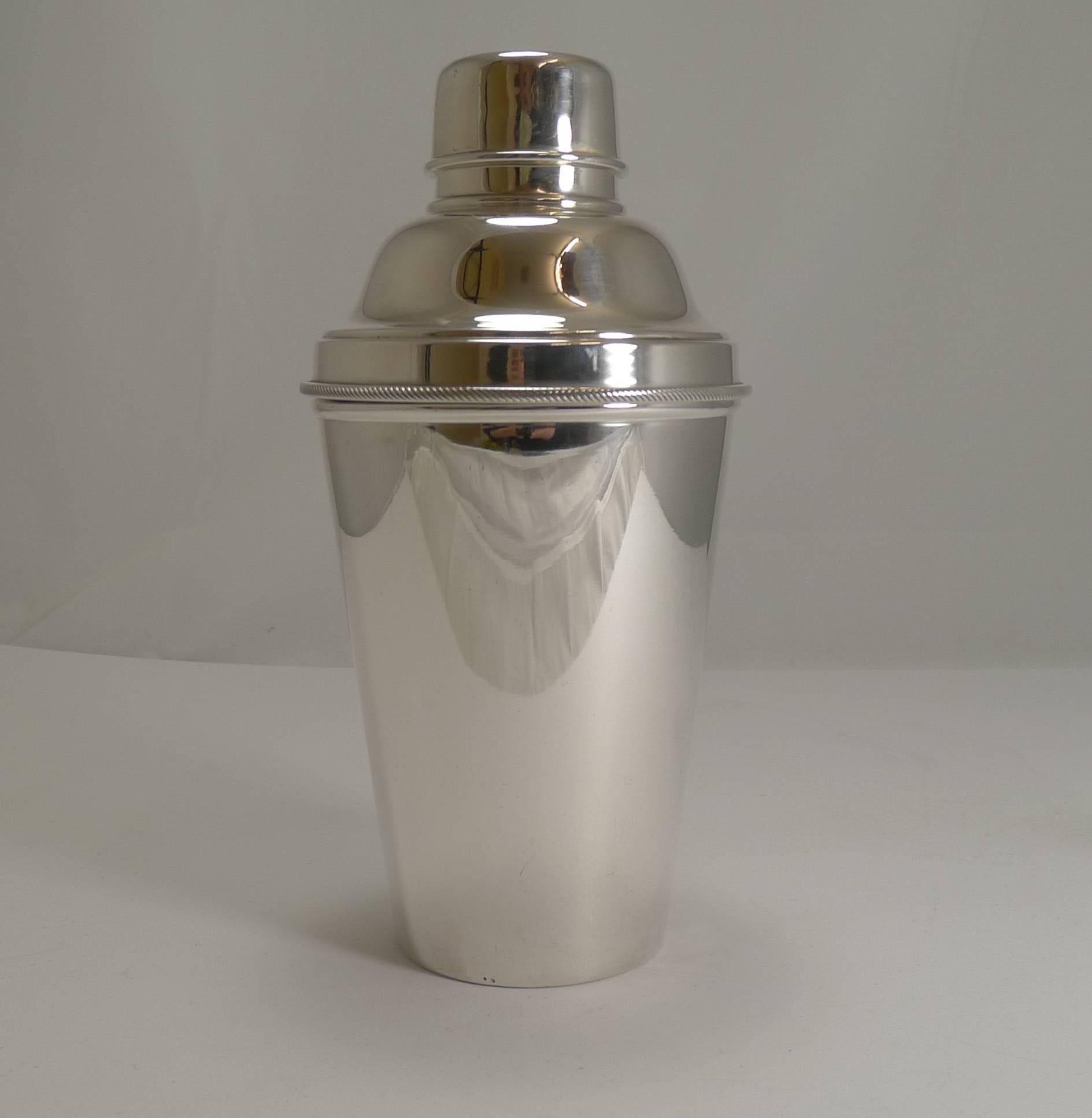 A wonderful and most unusual cocktail shaker without a makers mark, signed by the well renowned silversmith, James Dixon and Sons, the underside marked EP for Electro-Plated Nickel Silver and also marked Made In England. It is the most desirable