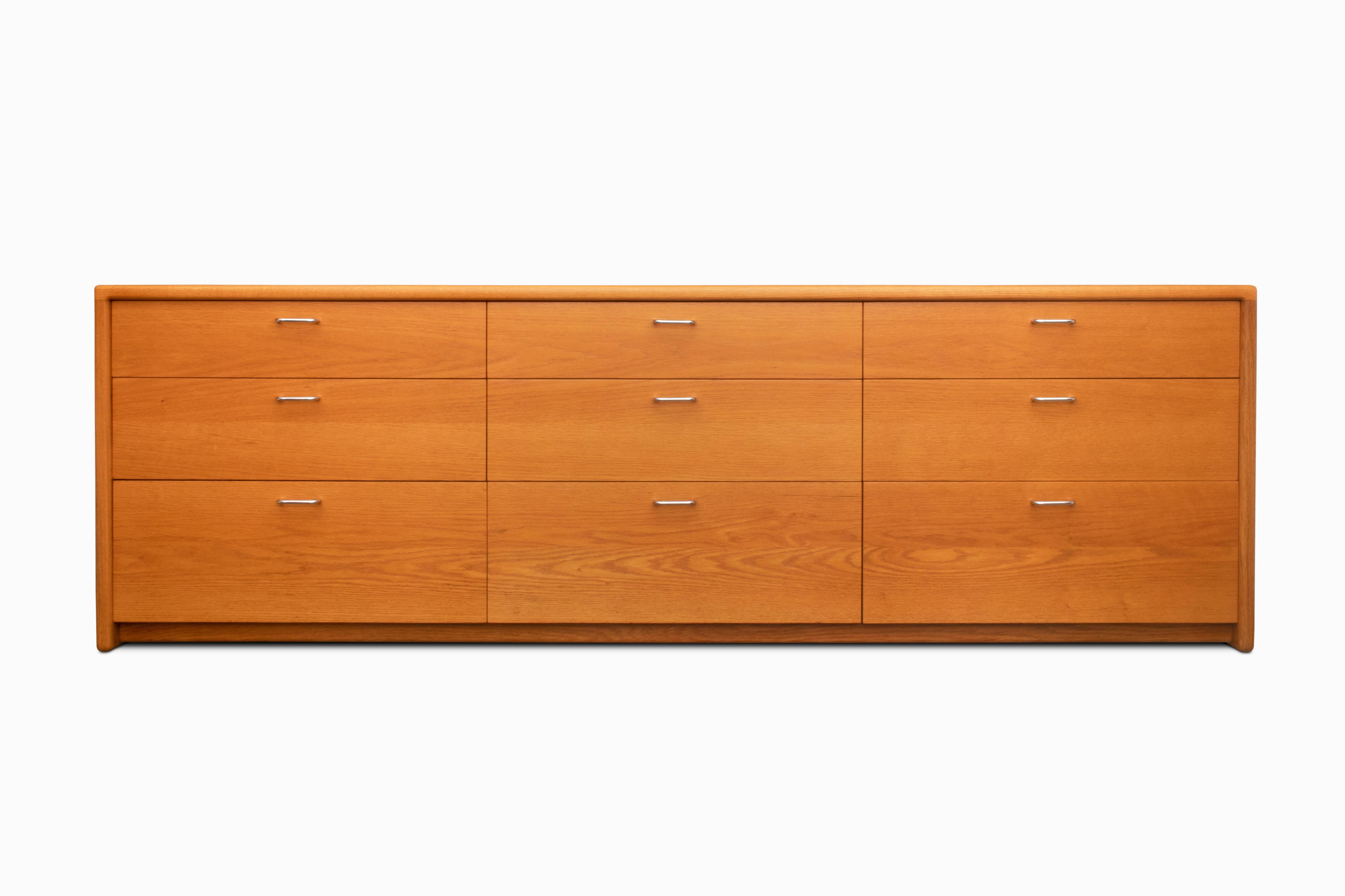 Here is a fantastic 9-drawer dresser by Gerald McCabe.  It is crafted in solid oak and features the interlocking joinery that the California designer is noted for.  This item has been completely refinished.  It measures a whopping 90
