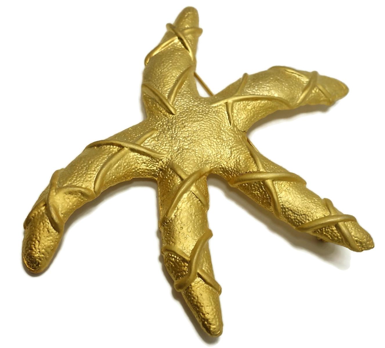 This large golden starfish brooch measure 4” x 3-1/8” and makes a huge impression.  We have never seen this fantastic brooch before and everyone who sees this unusual brooch walks away with a favorable impression.  It is in excellent condition.
