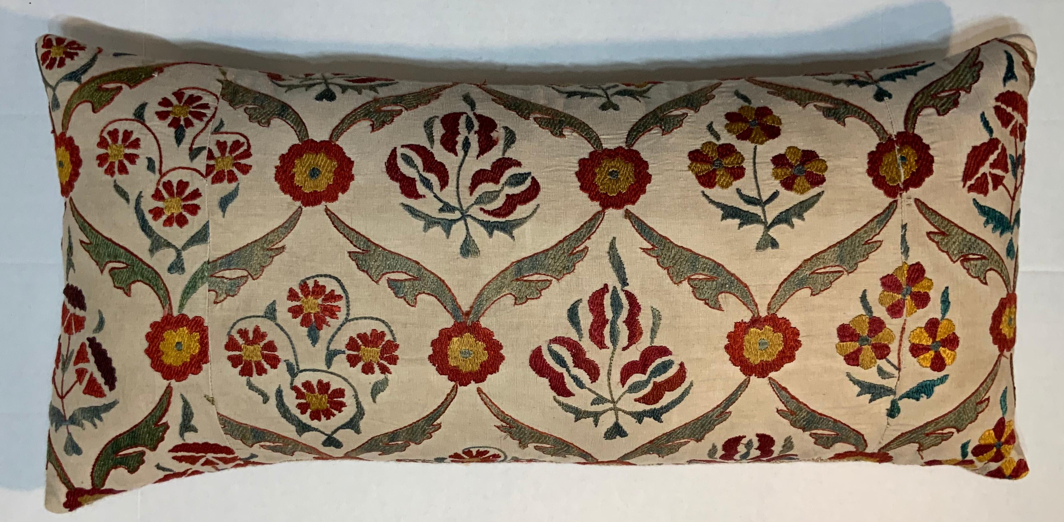 Beautiful pillow made silk hand embroidery Suzani fragment, very intricate motifs of vine and flowers on a cream background.
Fresh down and feather insert, fine backing.
  