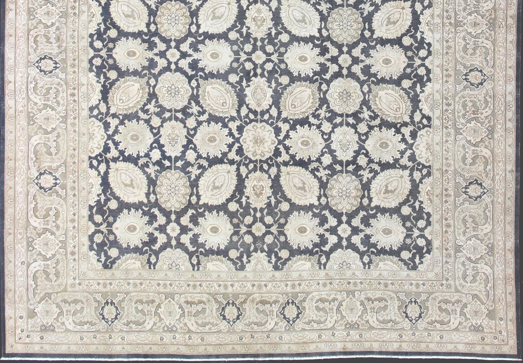 Steel Gray background, tan and gray Tabriz rug from Persia with Repeating Geometric design. Keivan Woven Arts / rug SUS-2009-516, country of origin / type: Iran / Tabriz, circa 1940
Measures: 11'5 x 15'11.
This vintage Persian Tabriz carpet (circa