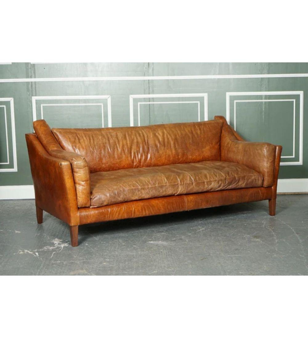 We are delighted to offer for sale this Stunning Vintage Tan Leather Contemporary Designer Sofa.

The sofa is very comfortable and can easily sit 3 to 4 people.

The leather this sofa has beautifully aged, it adds more character to the piece.