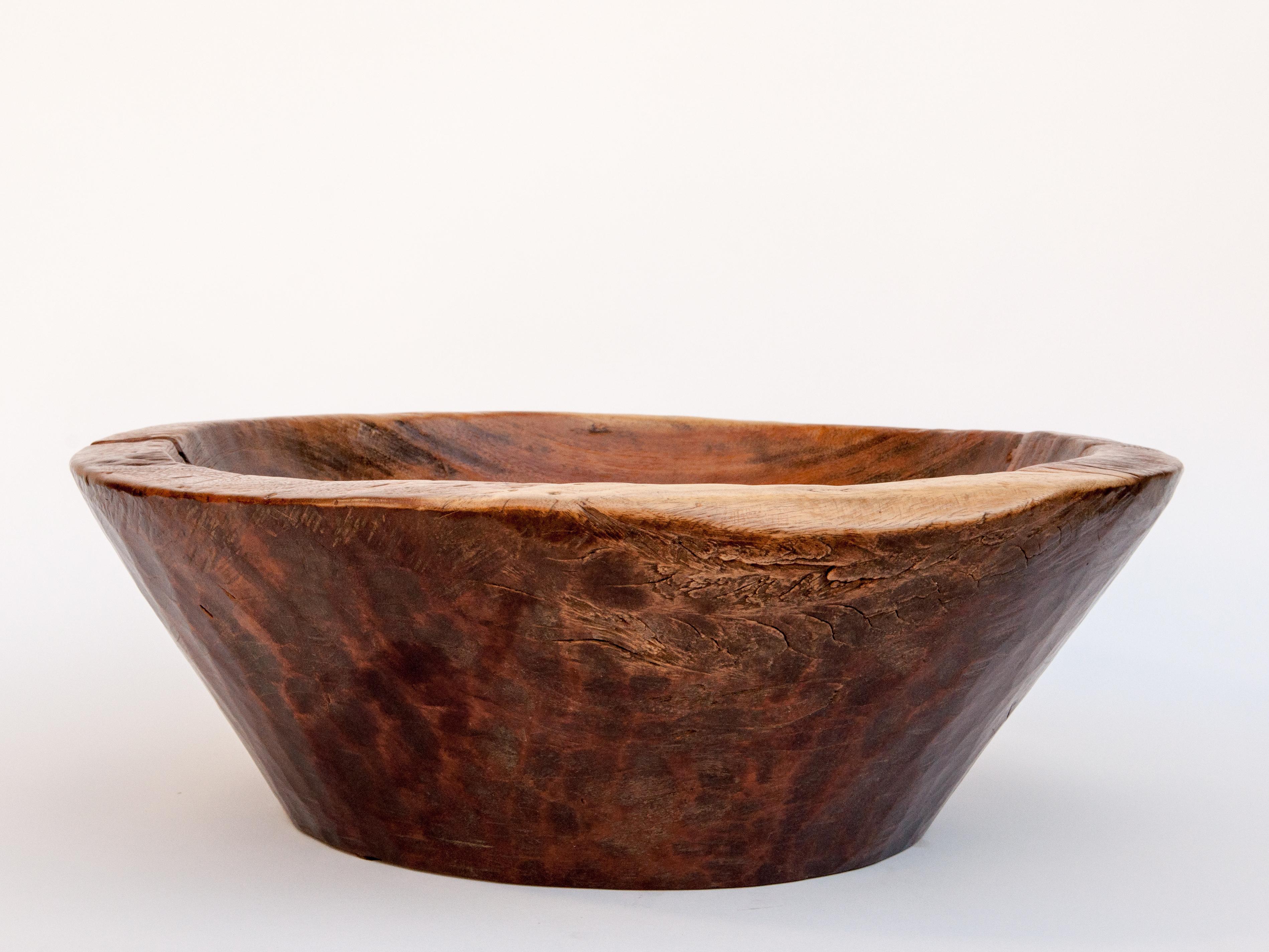 Large vintage teak bowl, hand hewn, 23 Dia Cirebon, North Java, mid-20th century
This rustic wood bowl was fashioned by hand from a single piece of teak wood and comes from the Cirebon area of Northern Java. It would have been used to offer food or