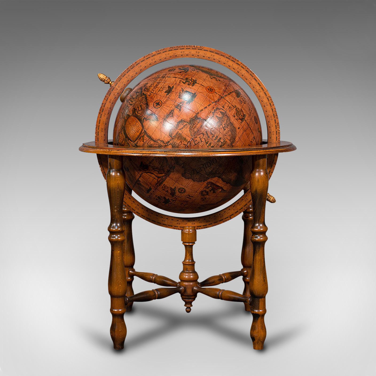 This is a large vintage terrestrial globe. A Continental, beech frame and papier-mâché gores to globe, dating to the late 20th century, circa 1970.

A dashing addition to the drawing room or library
Displaying a desirable aged patina
Beech frame