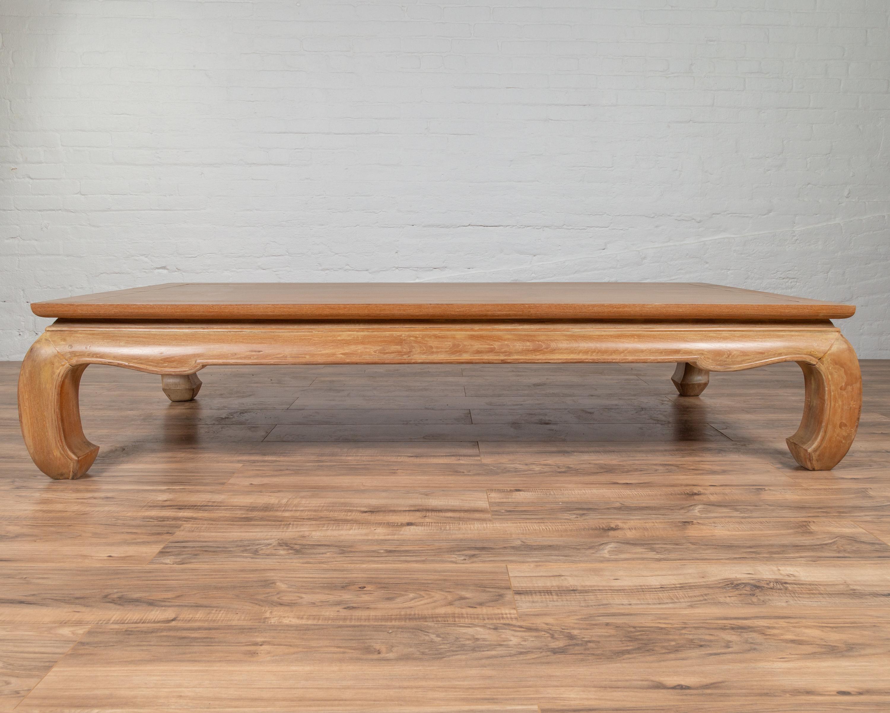 A large Thai vintage Chinese Ming Dynasty style teak wood coffee table from the mid 20th century, with natural patina and bulging chow legs. We currently have three available, priced and sold individually. Born in Thailand during the mid-century
